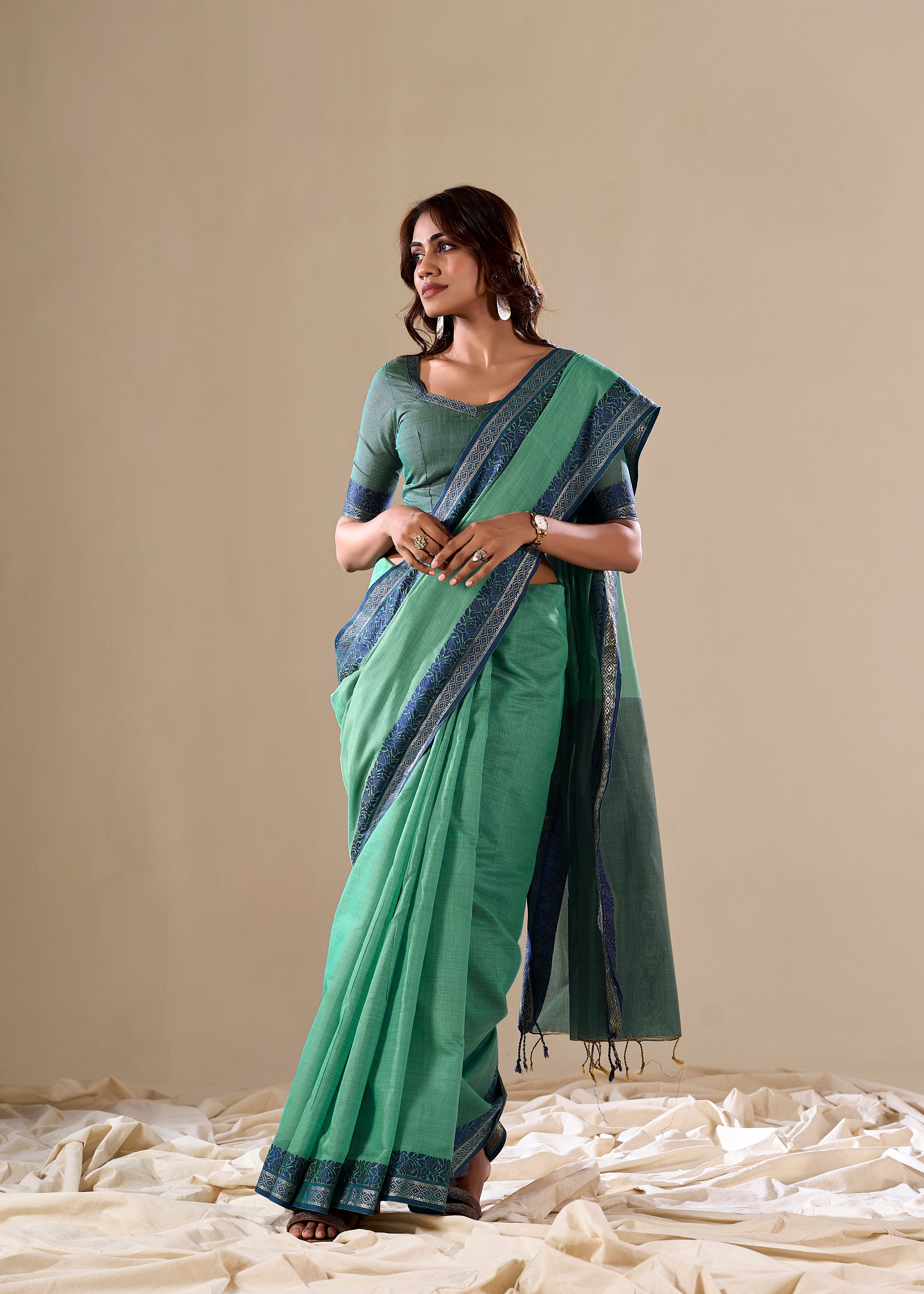 Green handloom saree with navy blue border

