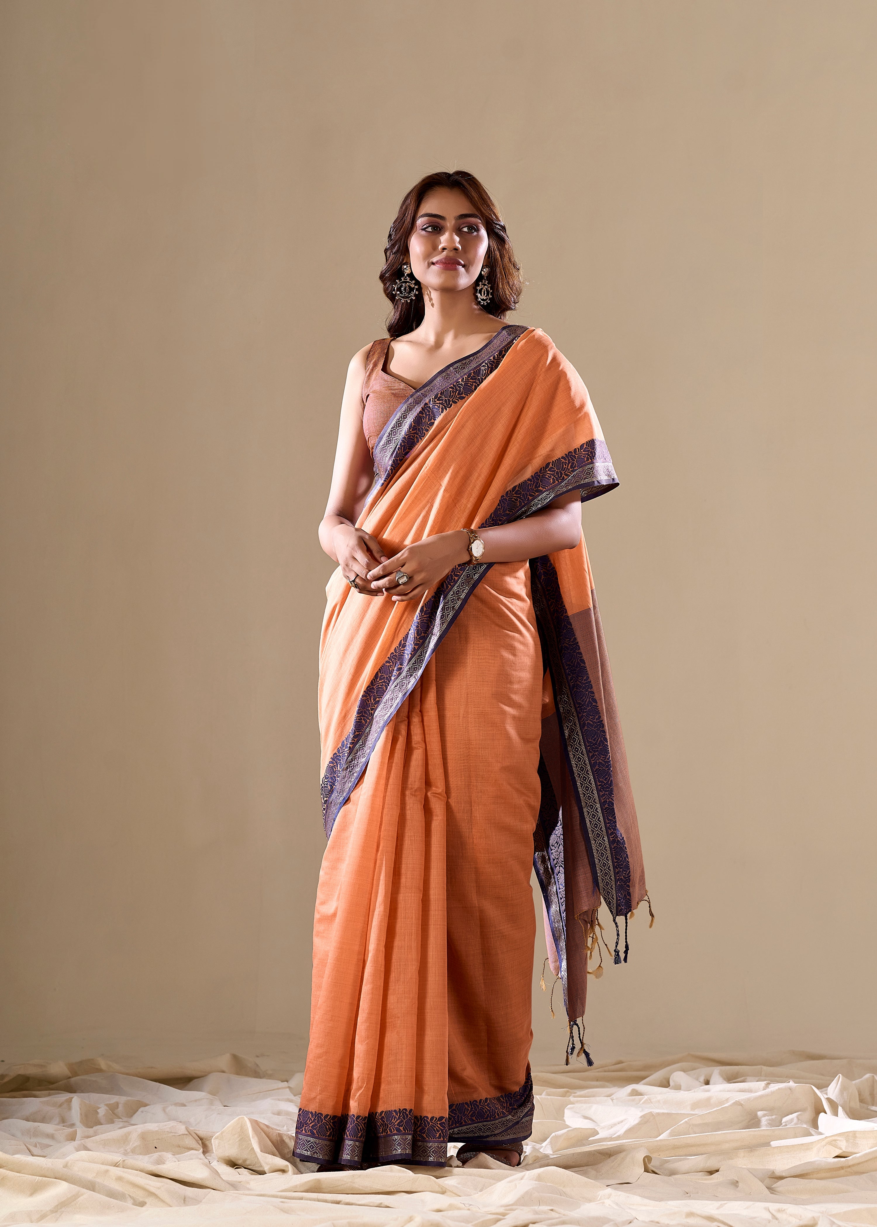 Orange handloom saree with blue border

