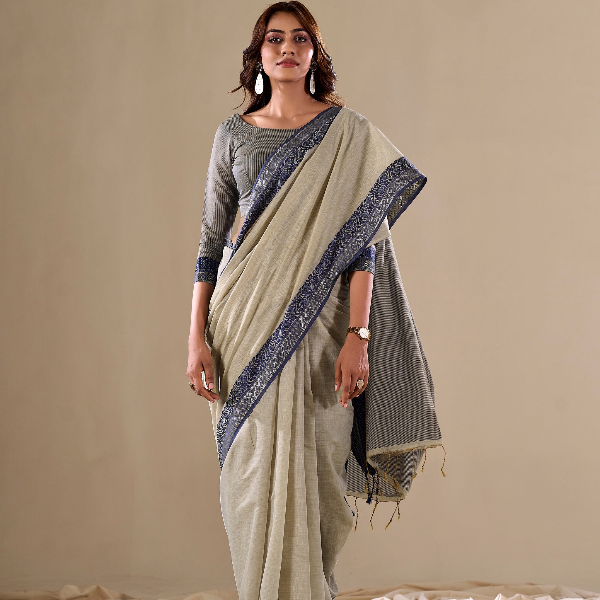 Cream handloom saree with blue border

