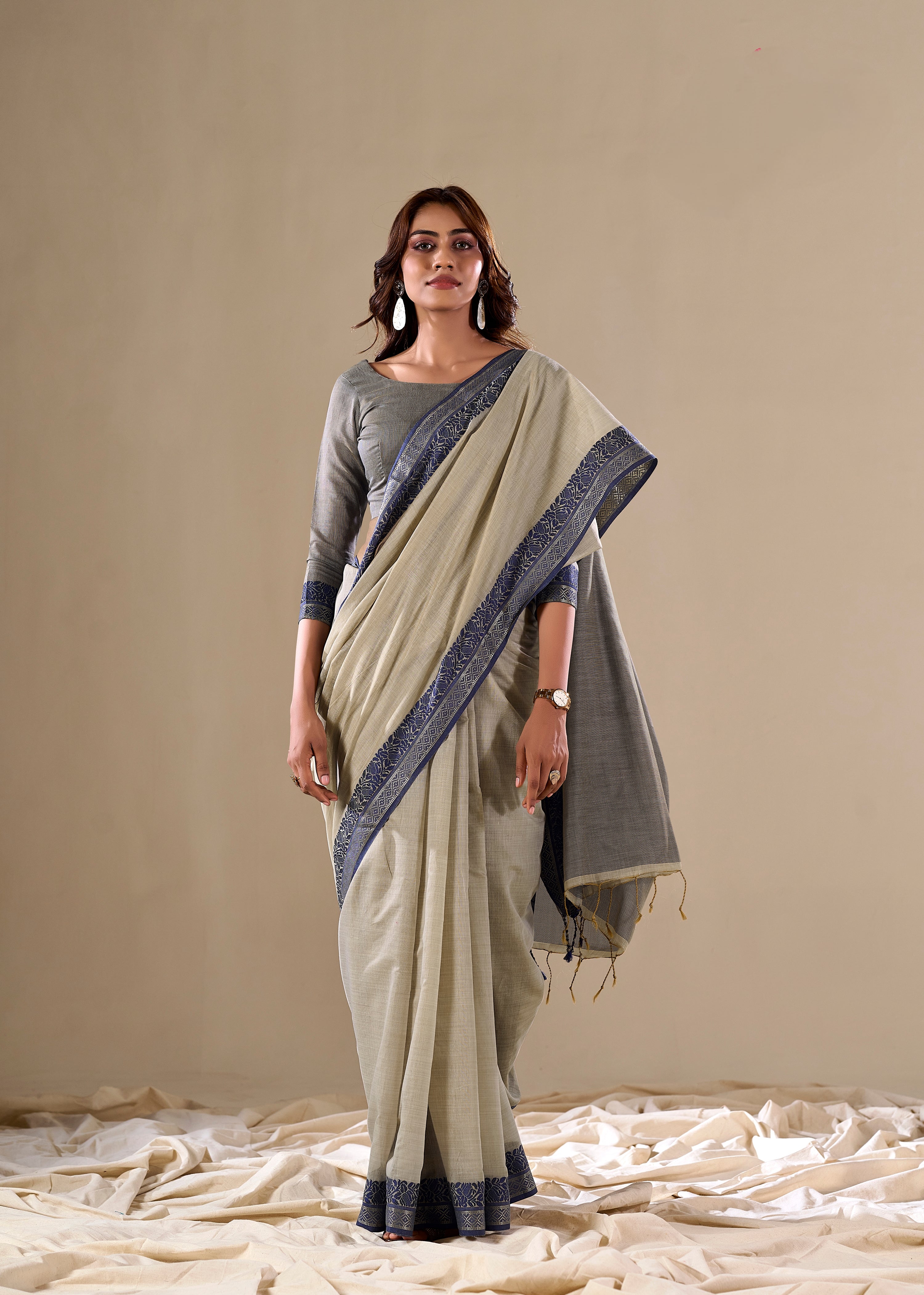 Cream handloom saree with blue border

