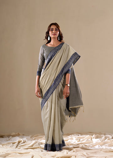 Cream handloom saree with blue border

