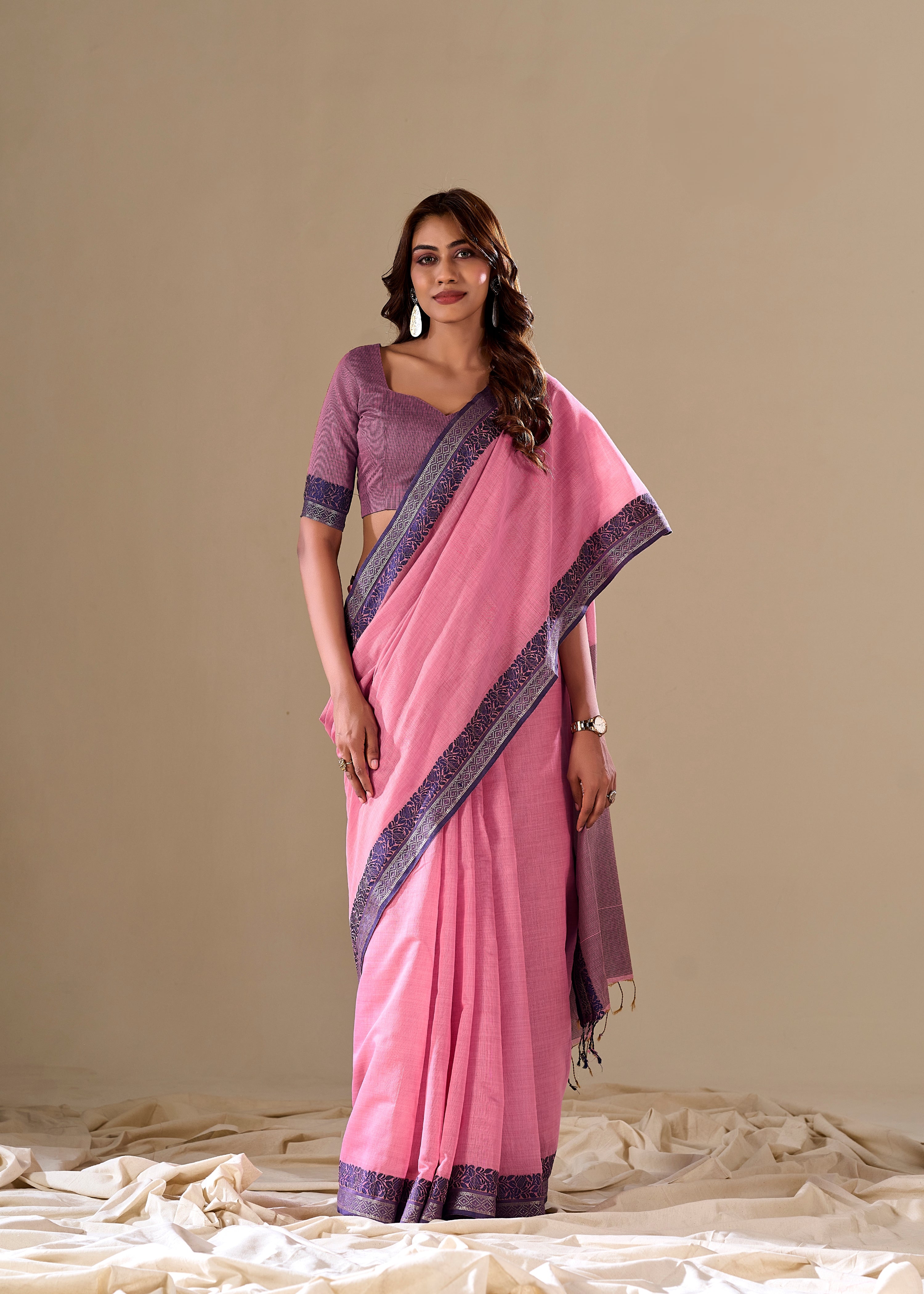Pink handloom saree with purple border

