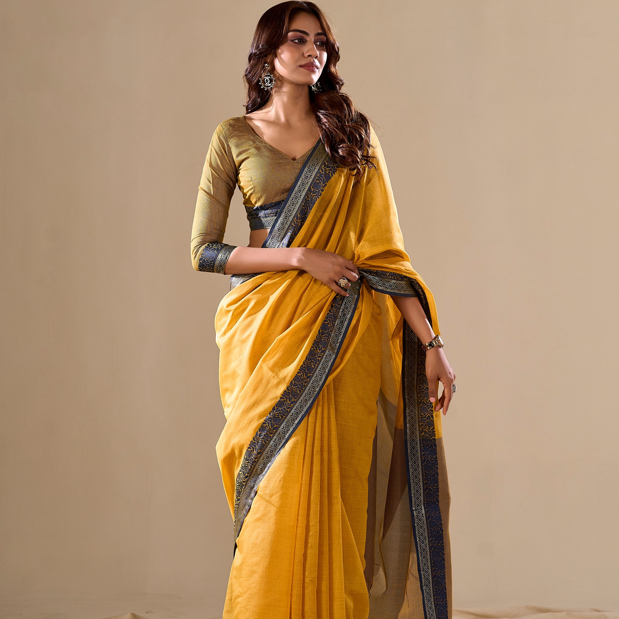 Mustard yellow silk saree with blue border

