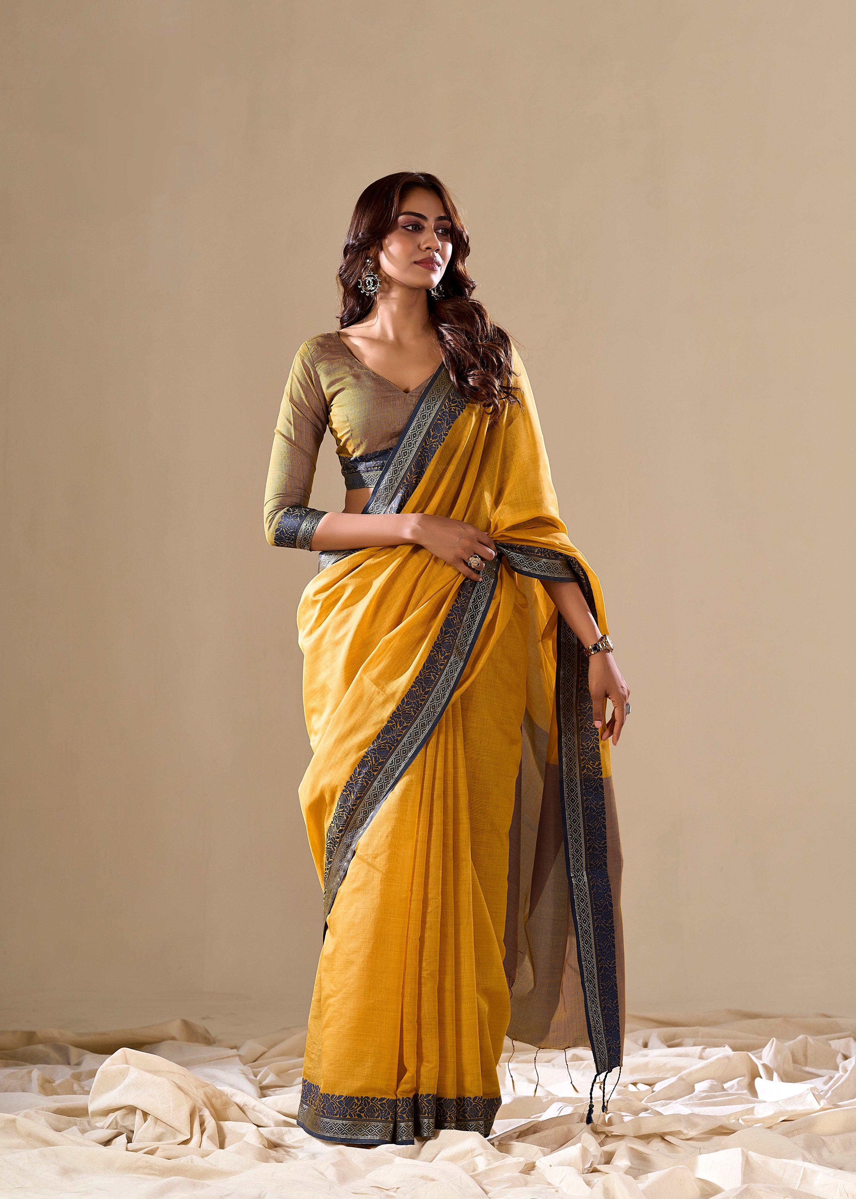 Mustard yellow silk saree with blue border

