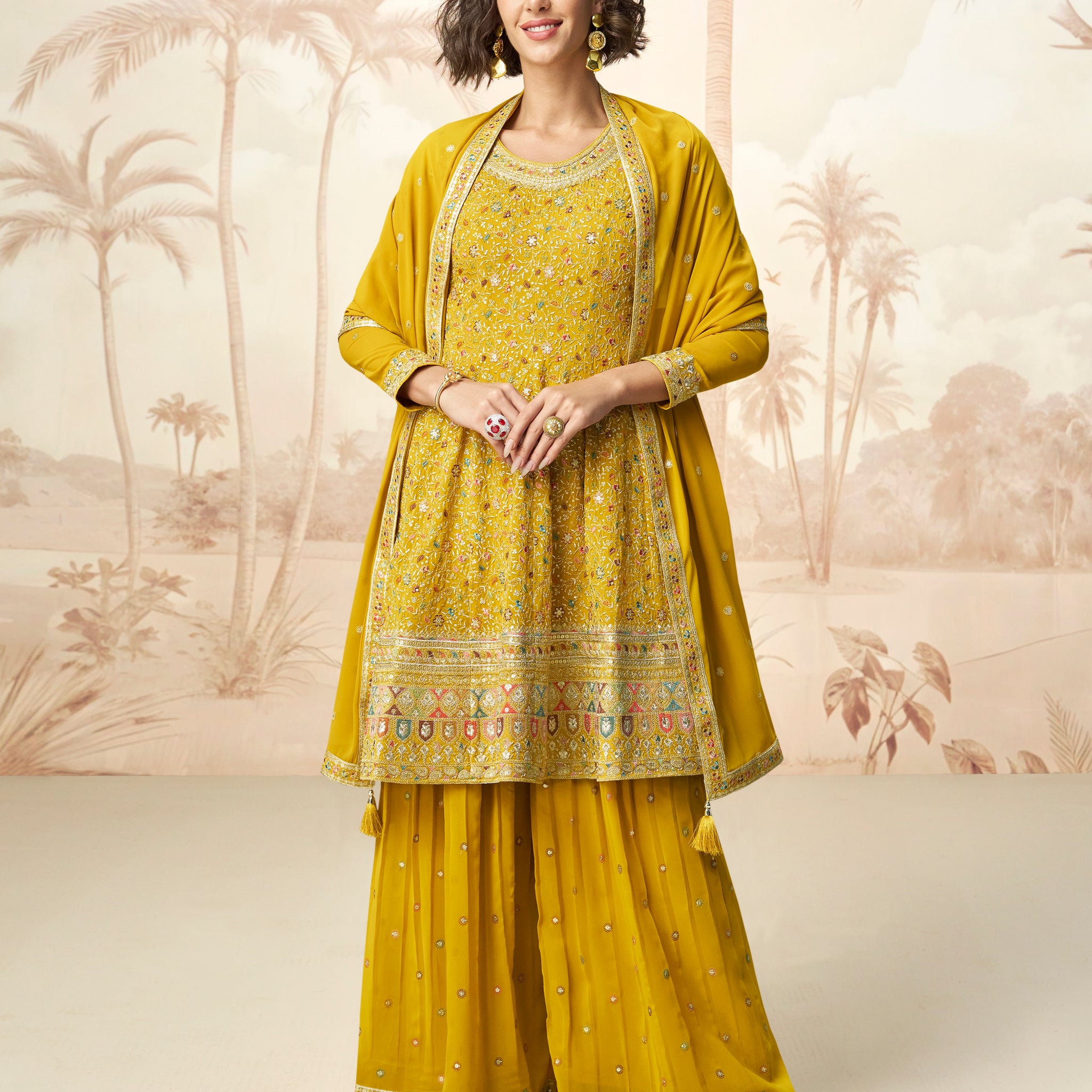 Mustard yellow embroidered georgette sharara suit front view