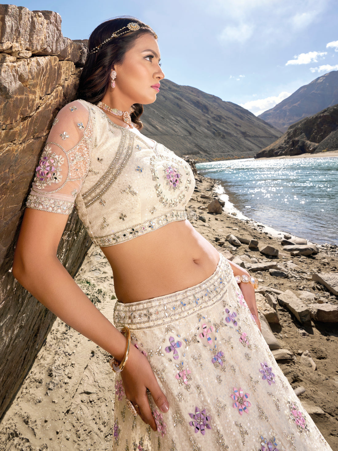 Ivory bridal lehenga with purple mirror and zarkan embroidery