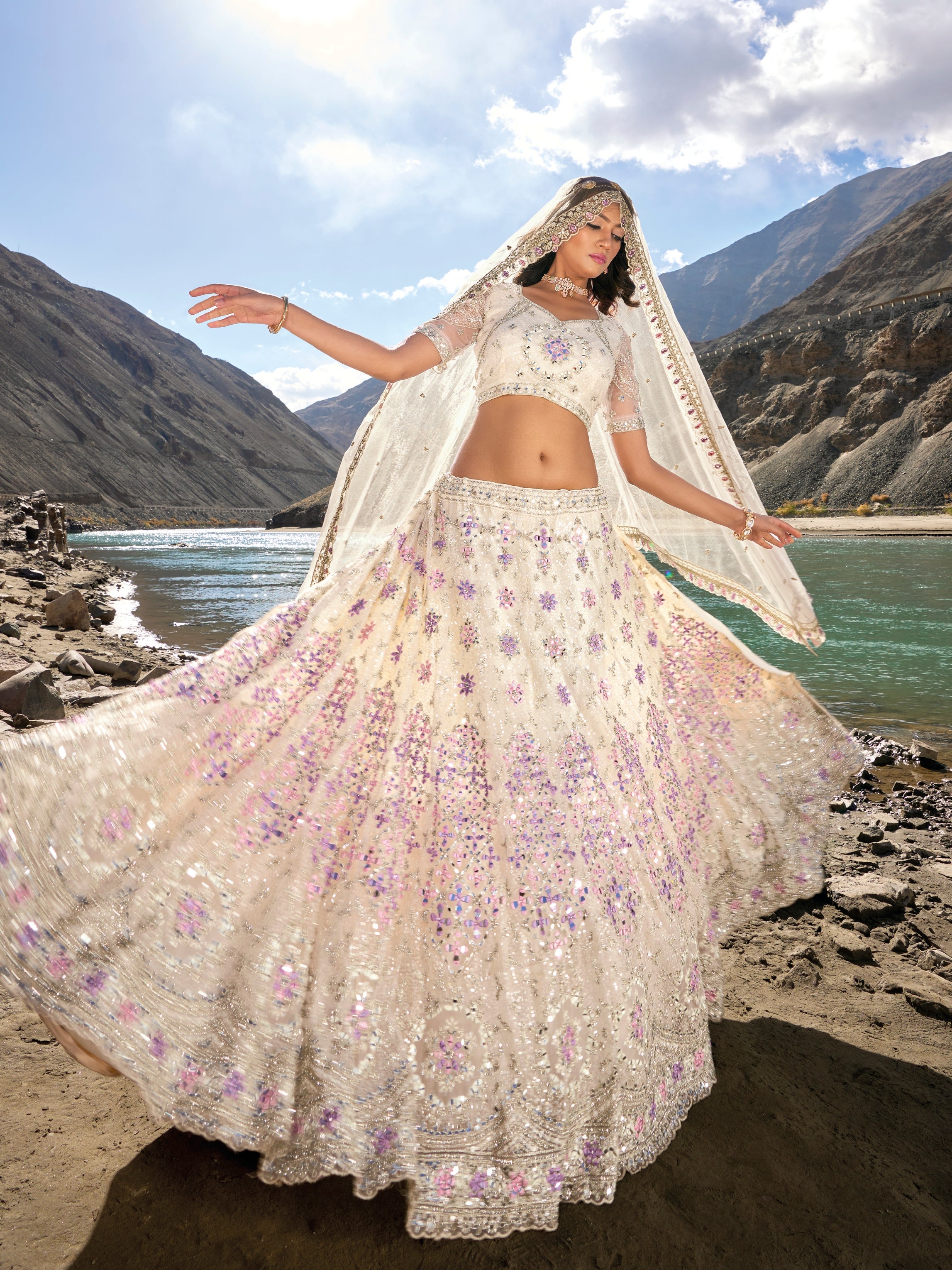 Ivory bridal lehenga with purple mirror and zarkan embroidery