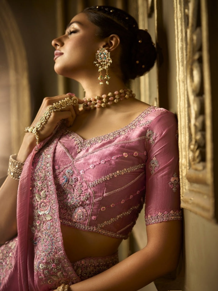 Rose pink bridal saree with golden silk fabric