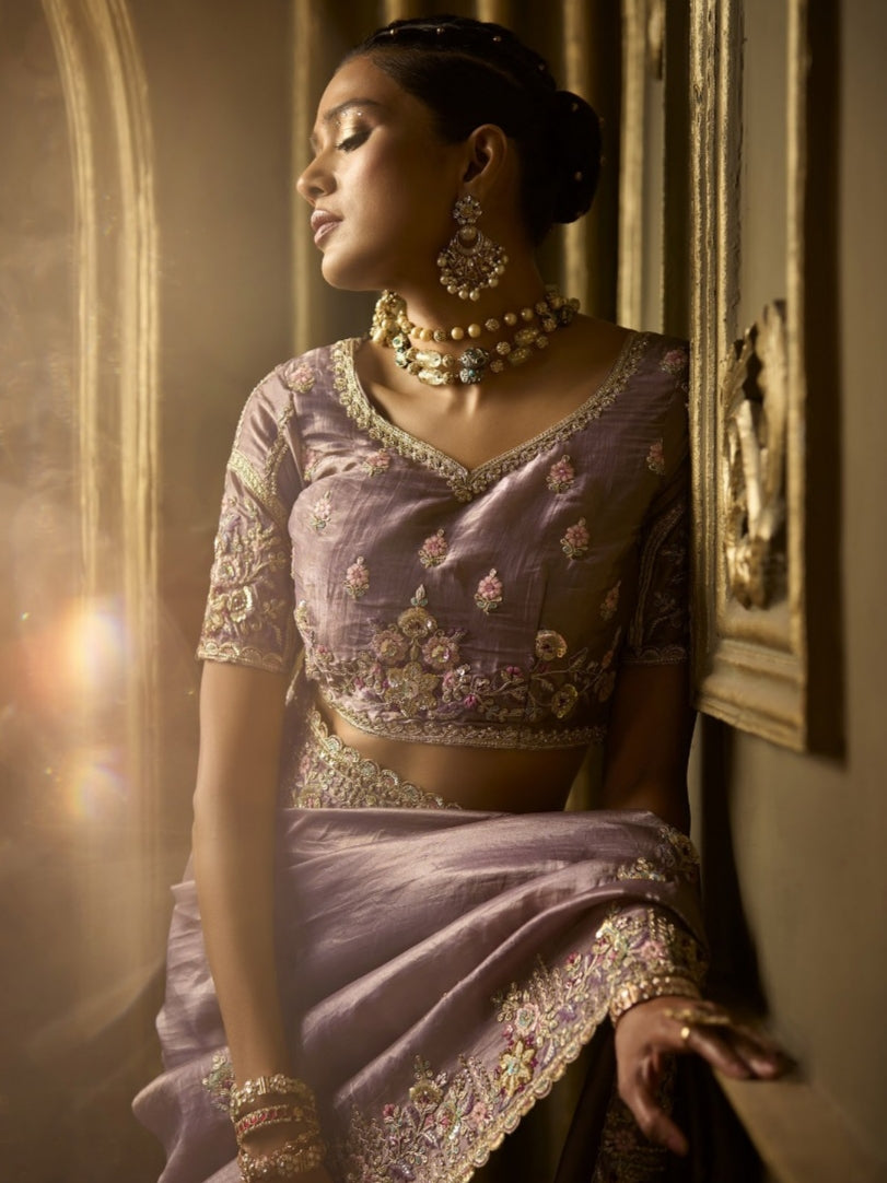 Traditional lavender bridal silk saree with handwork