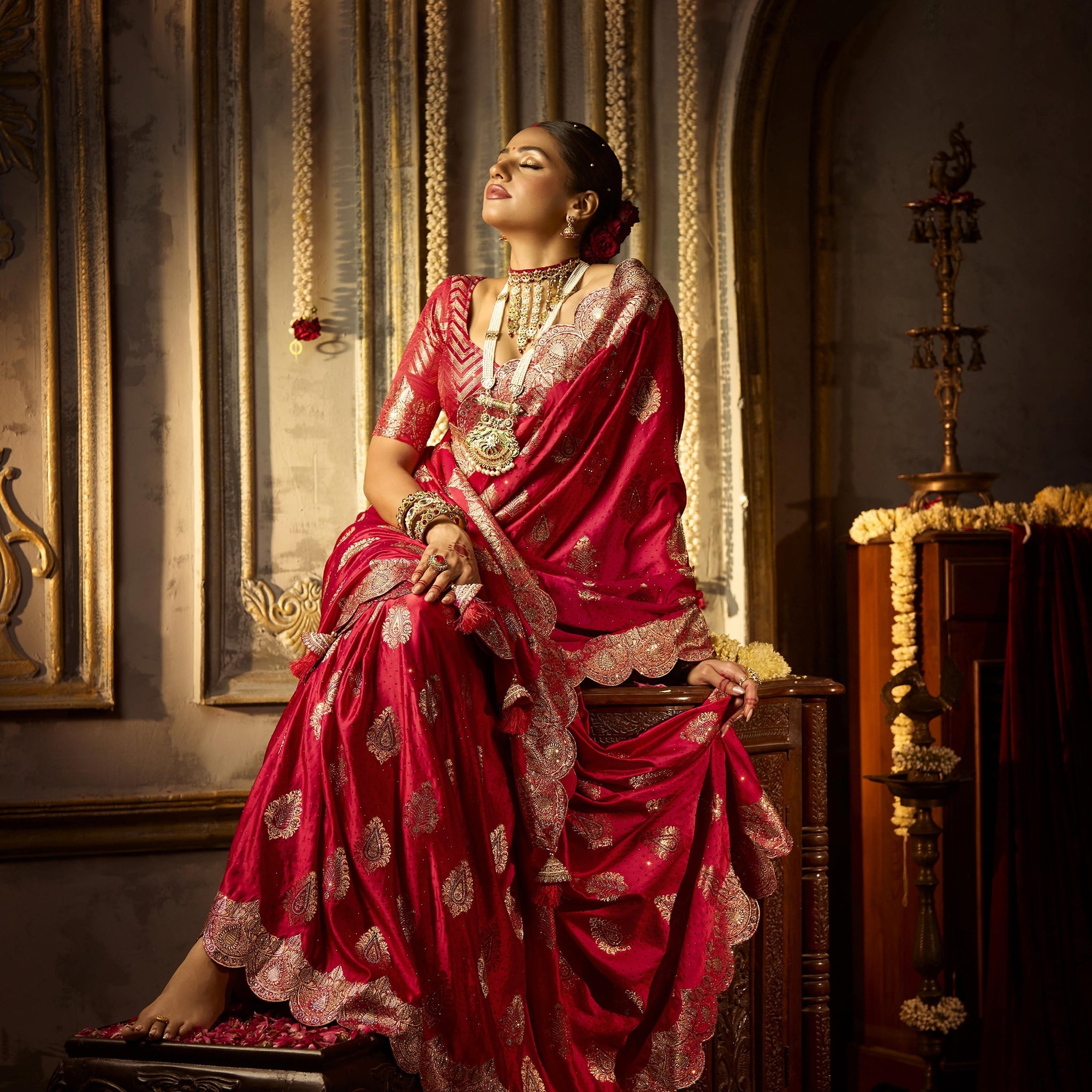 Elegant red satin silk bridal saree with heavy zircon and handwork

