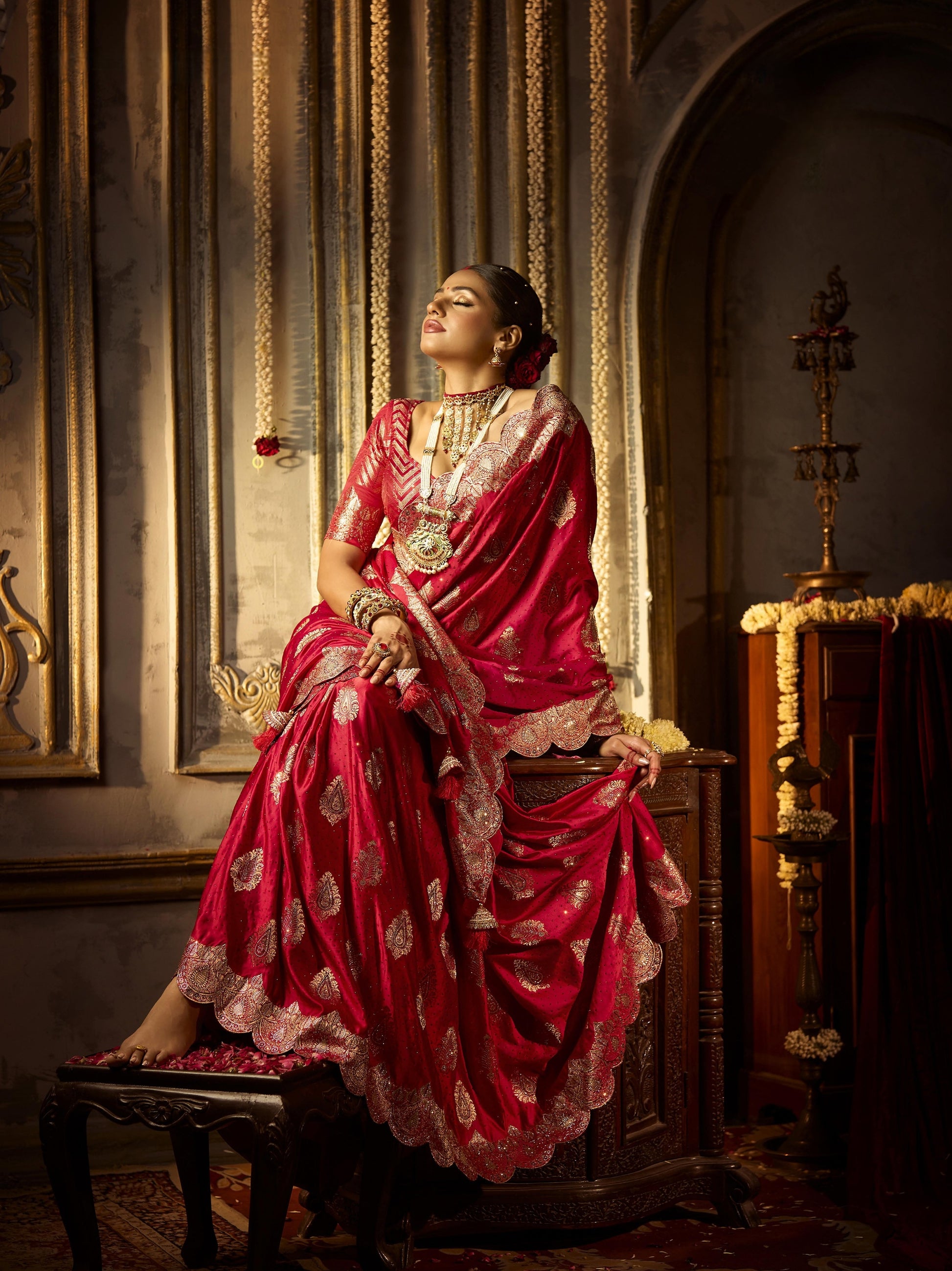 Elegant red satin silk bridal saree with heavy zircon and handwork

