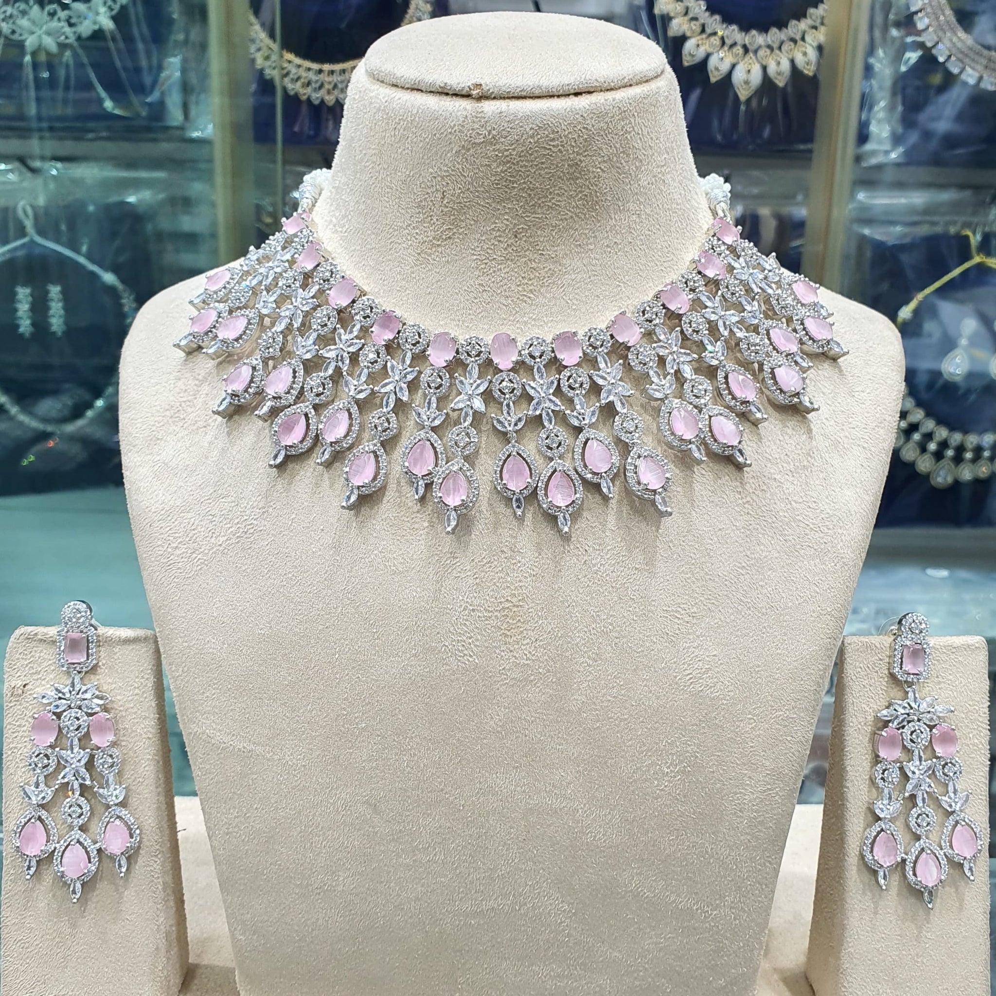 Light pink American diamond necklace set on mannequin