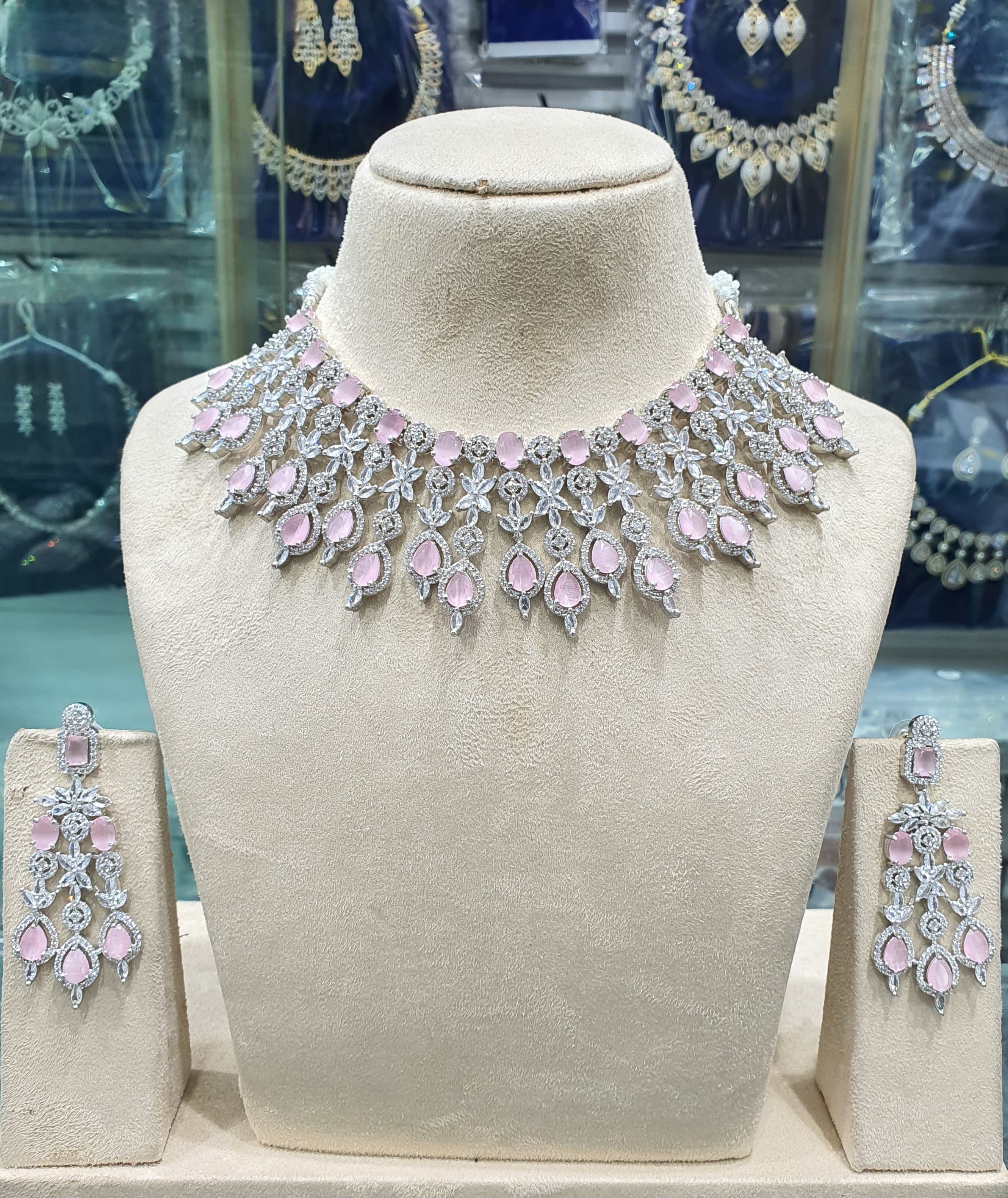 Light pink American diamond necklace set on mannequin