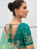 Embroidered butti saree with raw silk blouse for festive events