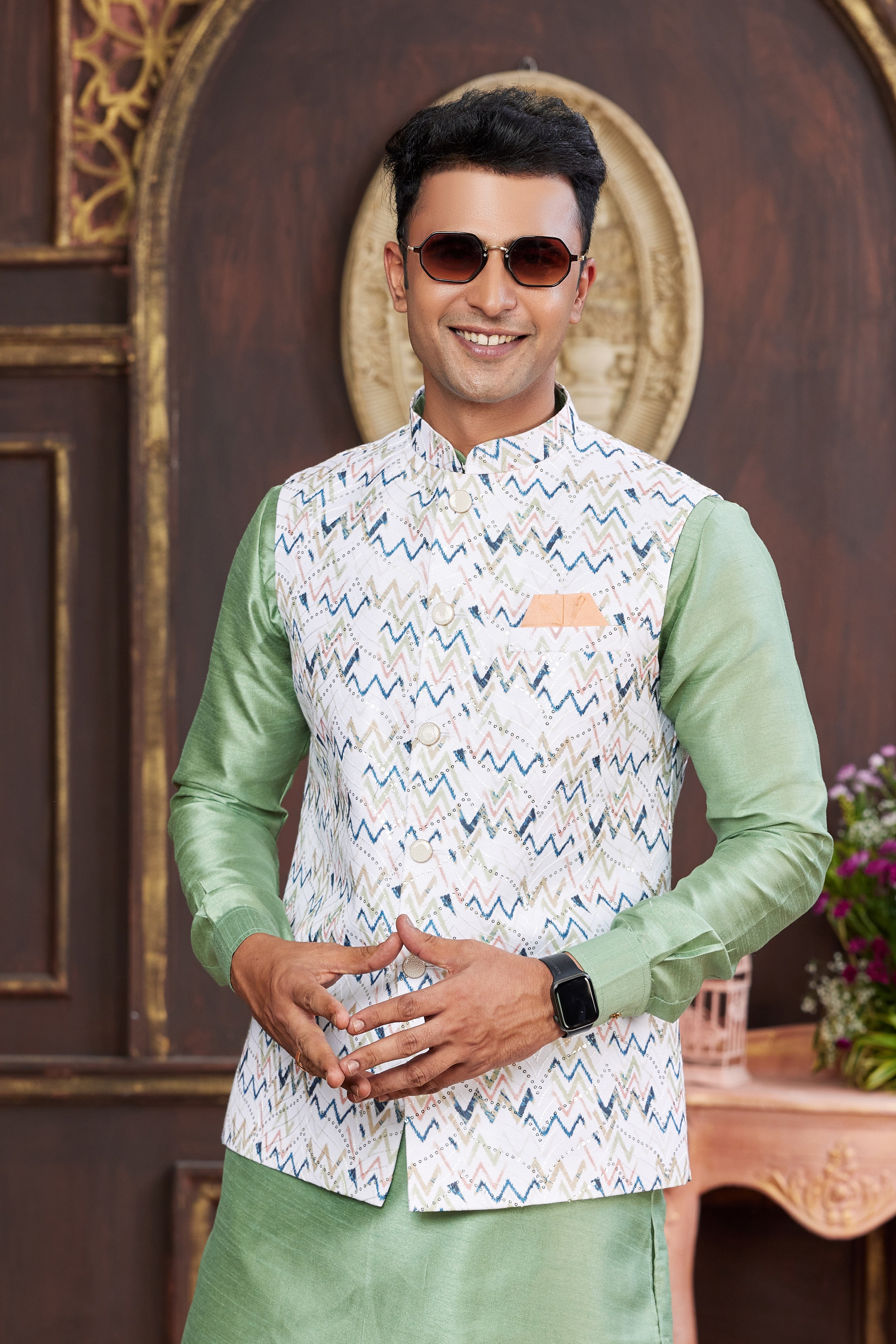 Groom’s ethnic green outfit for wedding