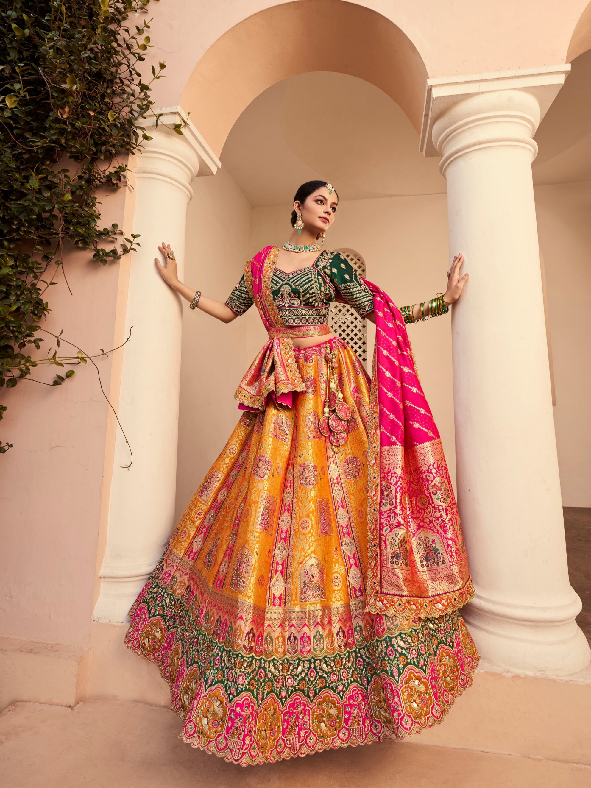 Mustard yellow Banarasi lehenga with green blouse

