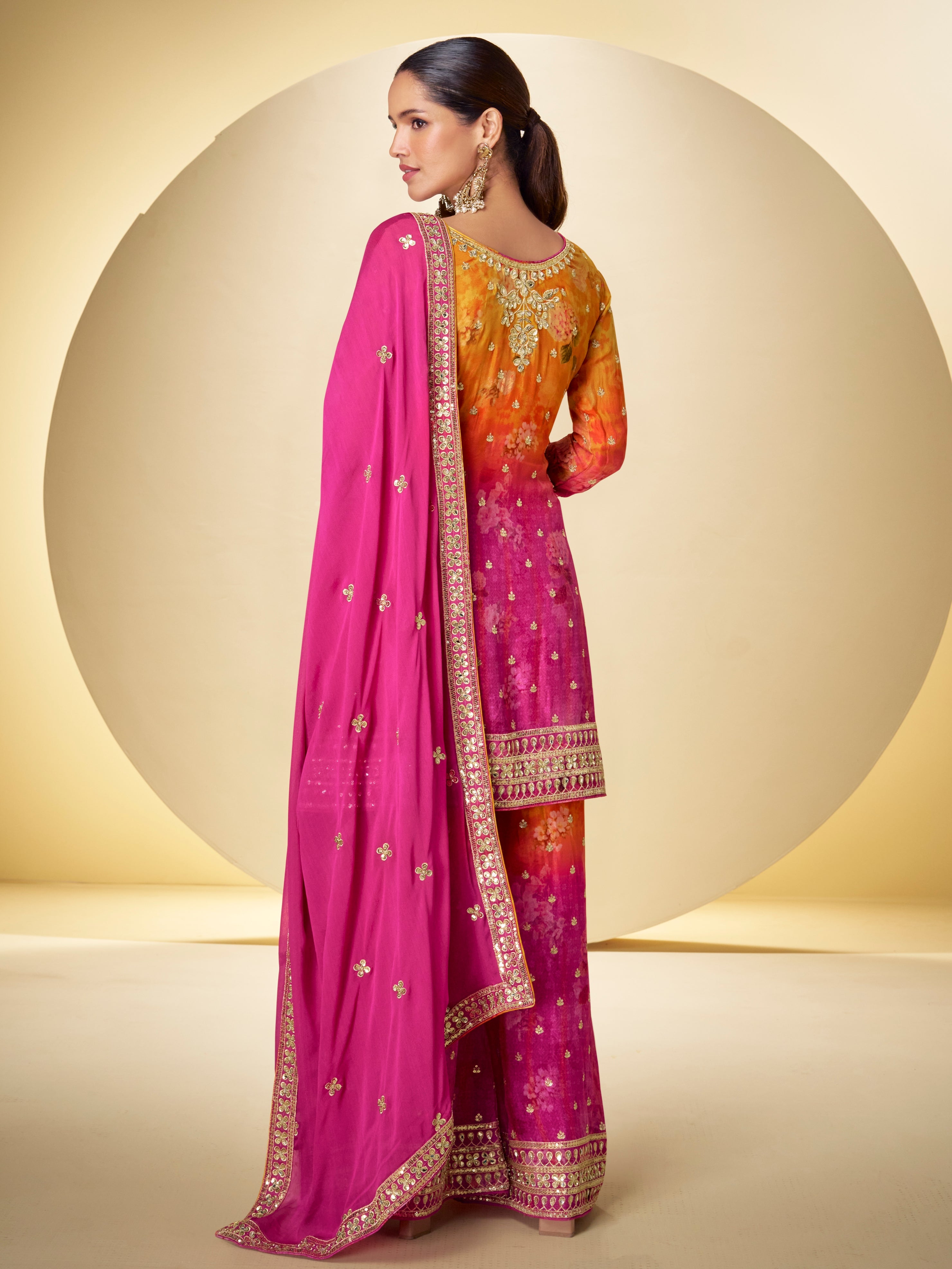 Back view of pink embroidered sharara suit for women