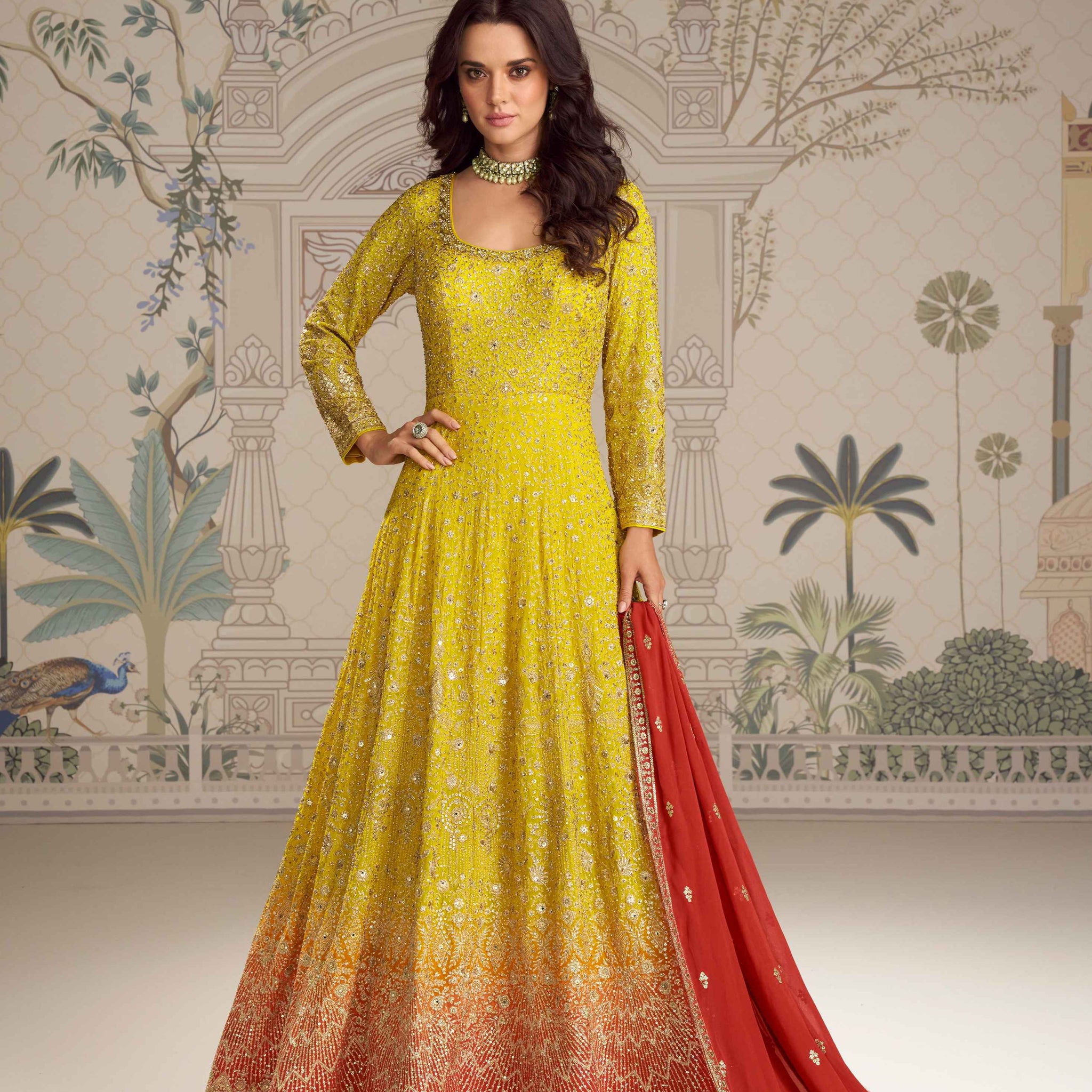 Yellow Anarkali gown with red embroidered dupatta