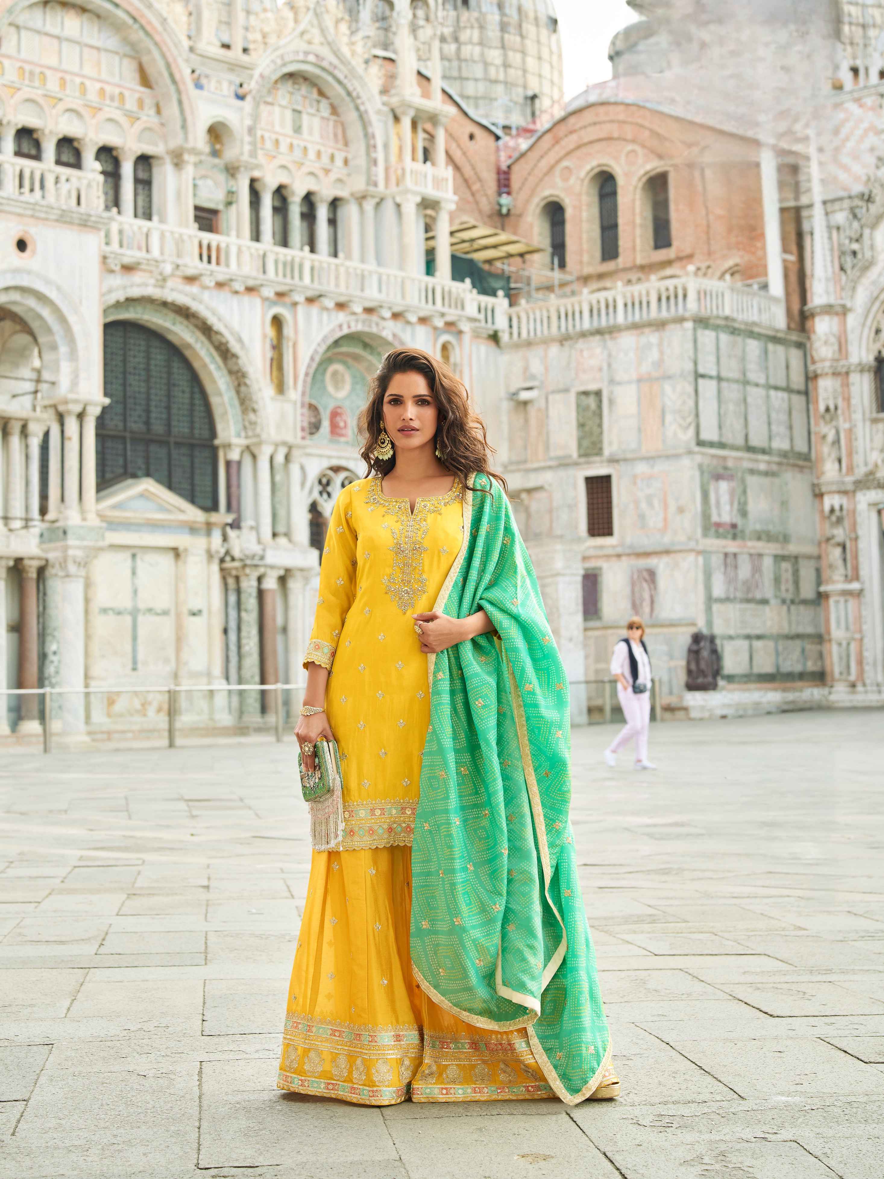 Yellow Embroidered Sharara Set with Contrast Green Dupatta Sharara Set Anant Tex Exports Pvt.Ltd..