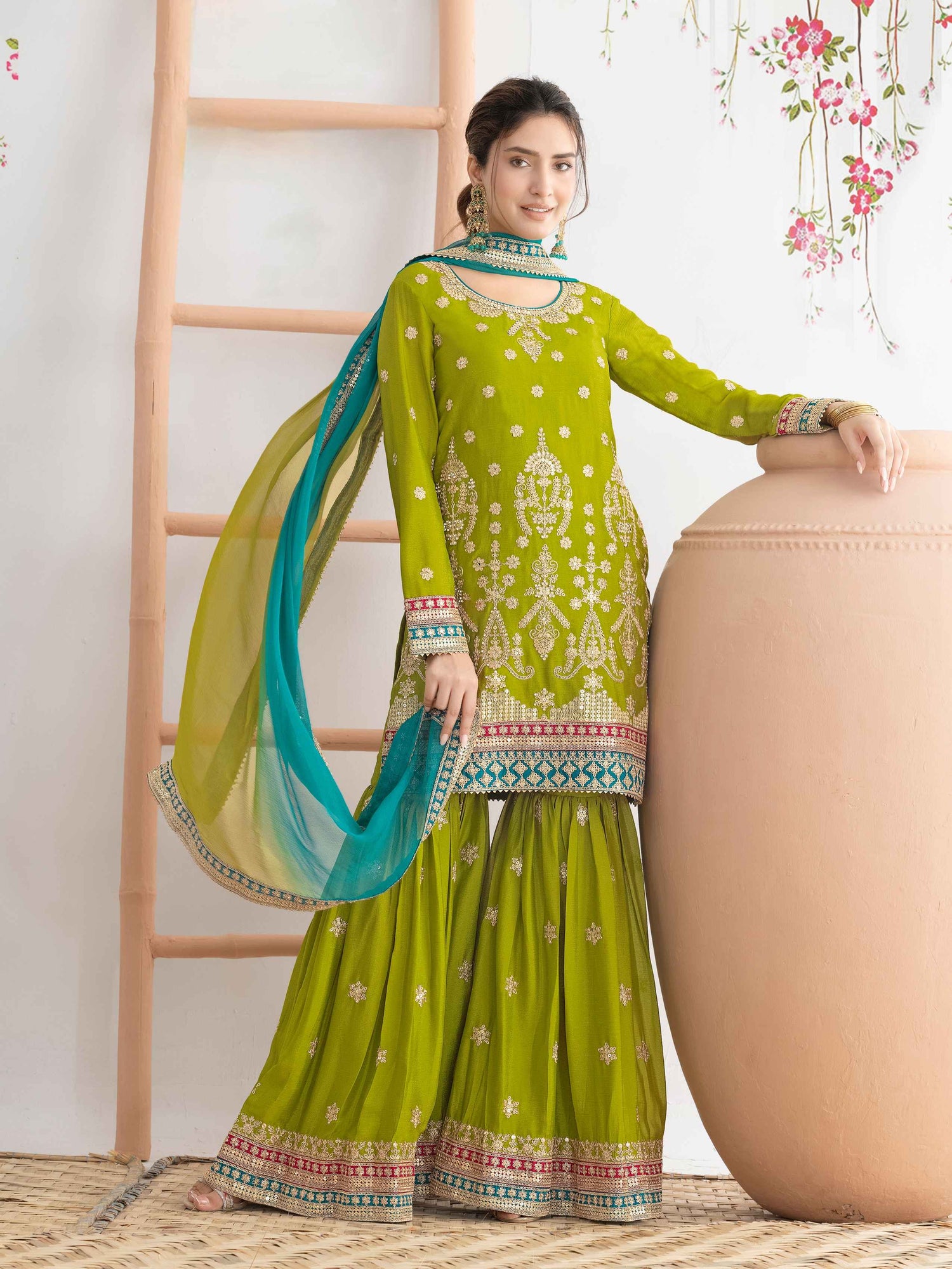 Green Heavy Embroidered Chinnon Sharara Suit with Dual Shade Dupatta Sharara Suit Anant Tex Exports Pvt.Ltd..