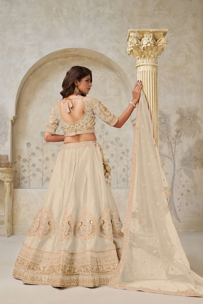 Beige Silk Wedding Lehenga with Leaf Embroidery and Soft Net Dupatta Silk lehenga Anant Tex Exports Pvt.Ltd..