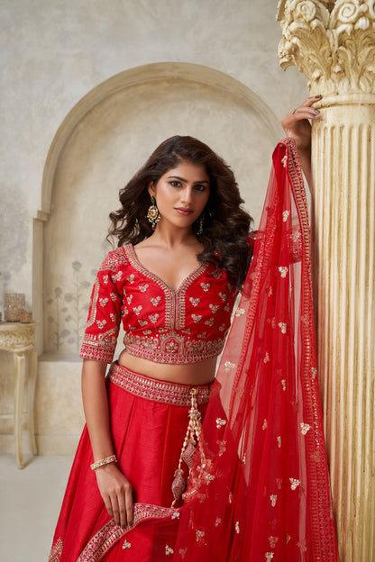 Red Silk Bridal Lehenga with Heavy Leaf Embroidery and Net Dupatta Silk lehenga Anant Tex Exports Pvt.Ltd..