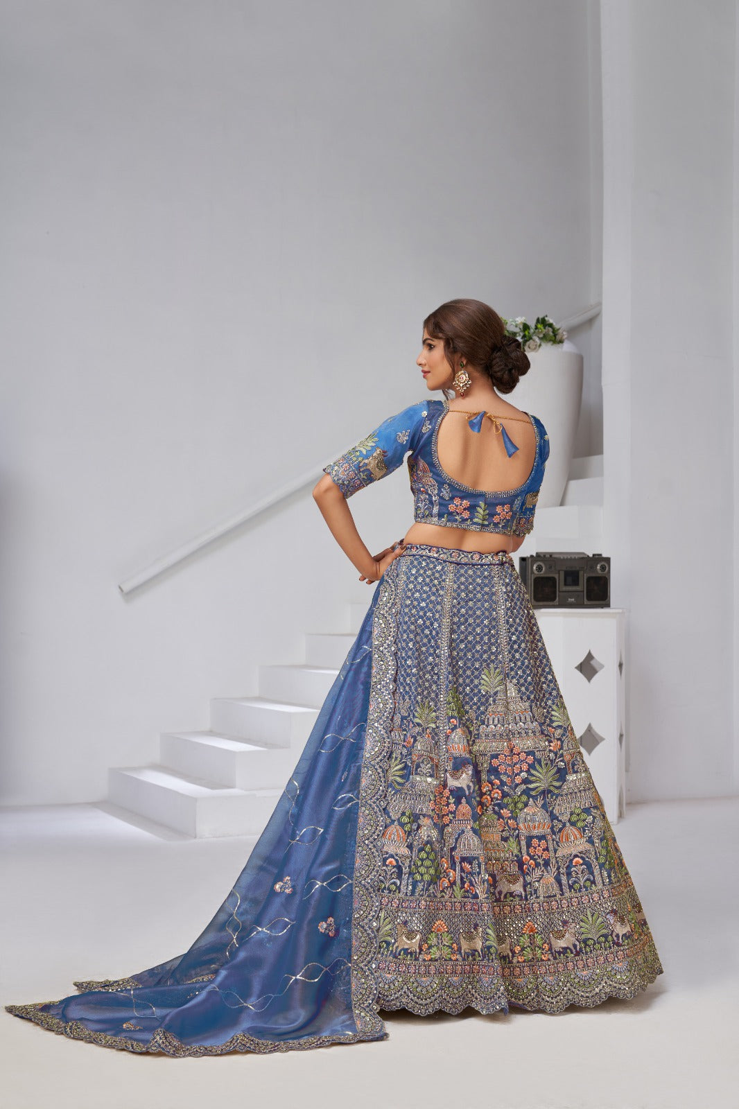 Blue Organza Tissue Bridal Lehenga with Temple &amp; Kamdhenu Cow Motifs Organza Lehenga Anant Tex Exports Pvt.Ltd..