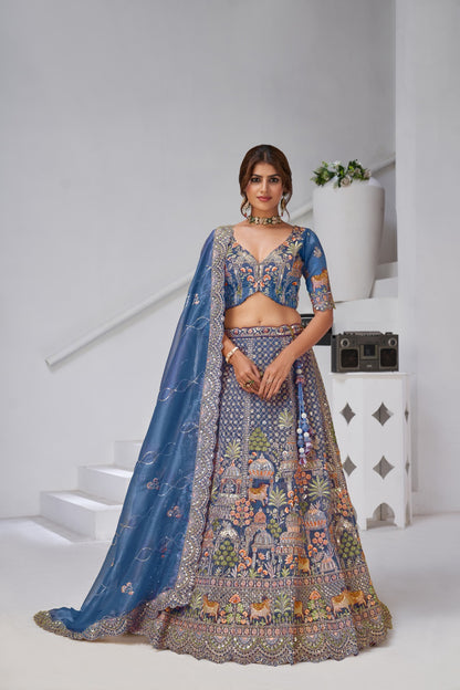 Blue Organza Tissue Bridal Lehenga with Temple &amp; Kamdhenu Cow Motifs Organza Lehenga Anant Tex Exports Pvt.Ltd..