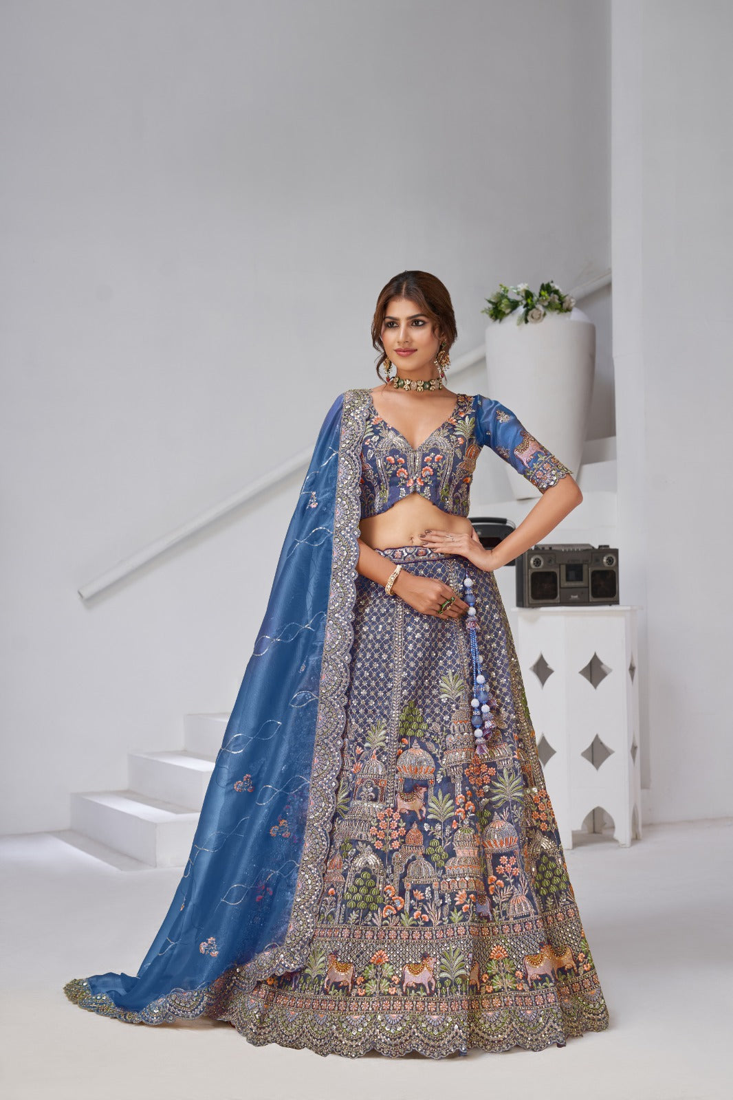 Blue Organza Tissue Bridal Lehenga with Temple &amp; Kamdhenu Cow Motifs Organza Lehenga Anant Tex Exports Pvt.Ltd..