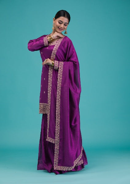 Traditional purple sharara dress for festive occasion

