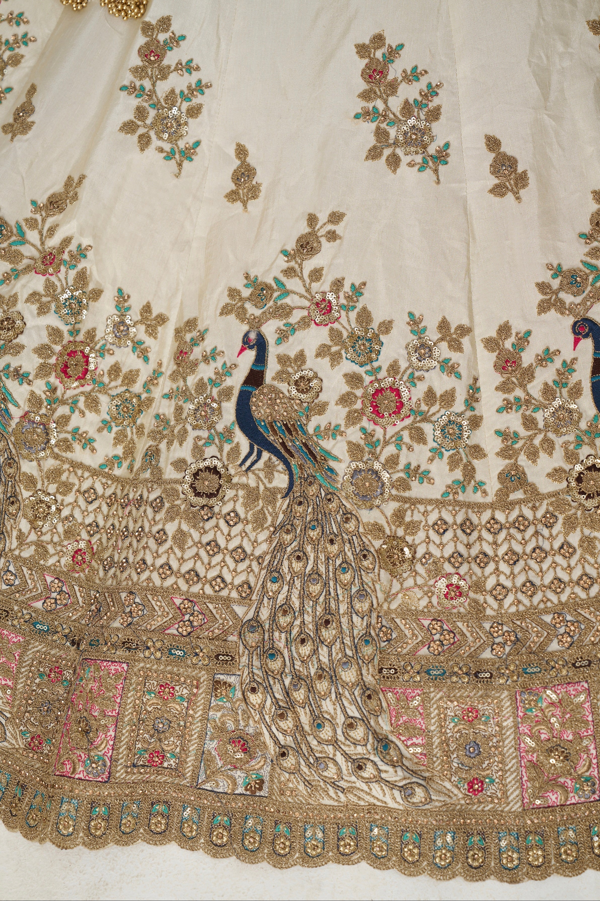 Heavy embroidered white silk bridal lehenga with pink embellished dupatta