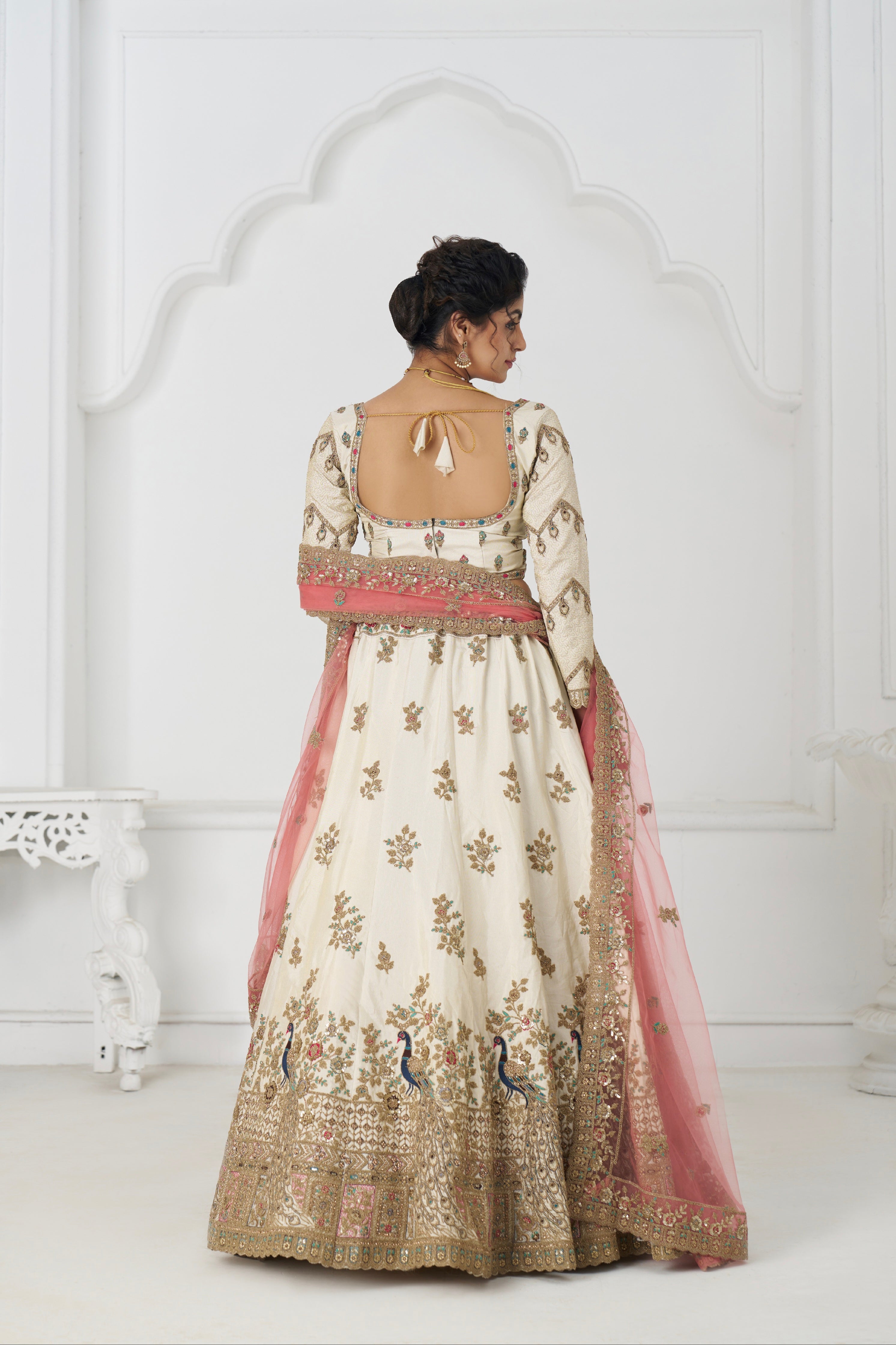 Traditional white zari silk wedding lehenga set with pastel pink dupatta