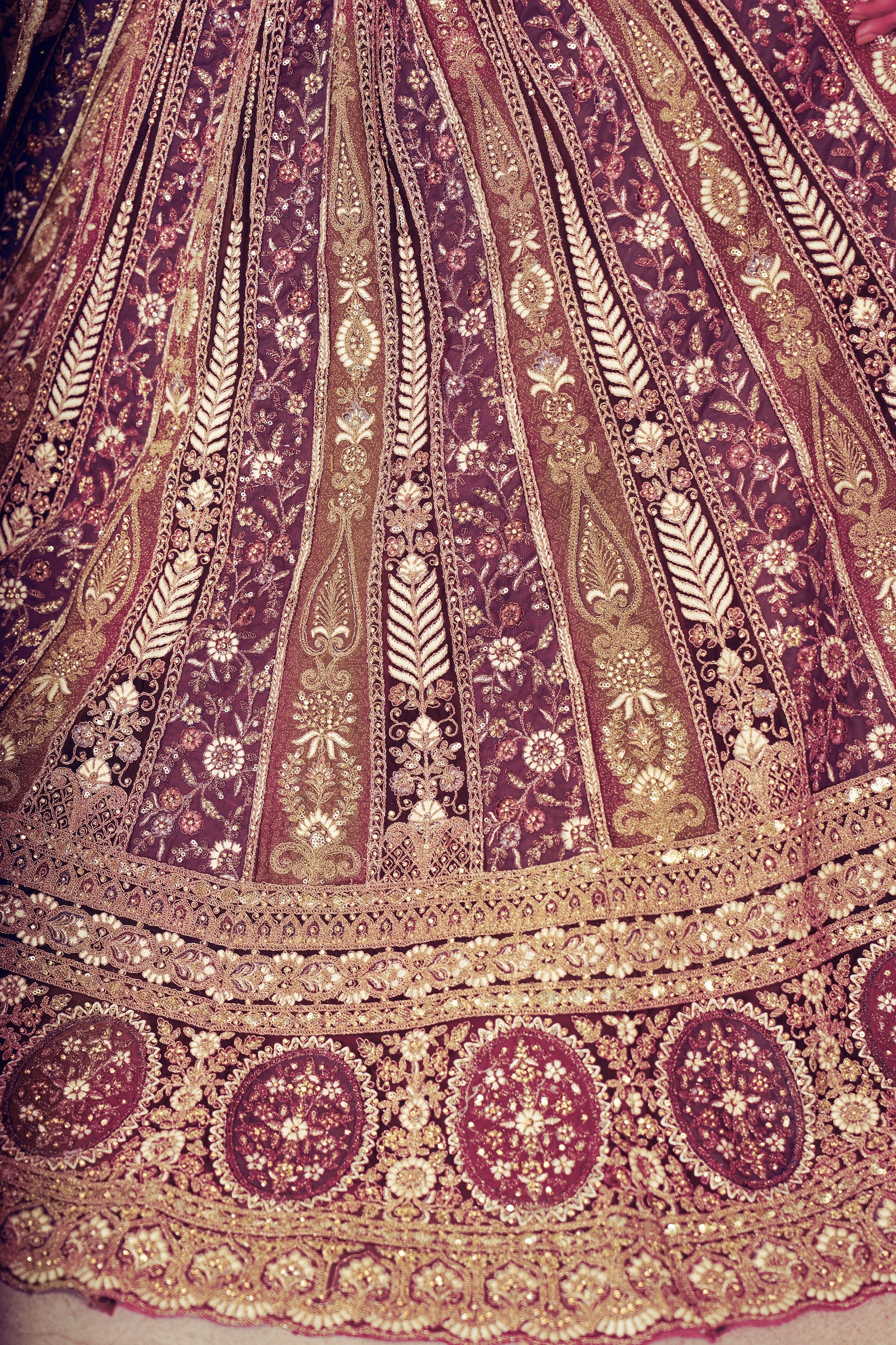 Heavily embroidered dark purple bridal lehenga with matching dupatta