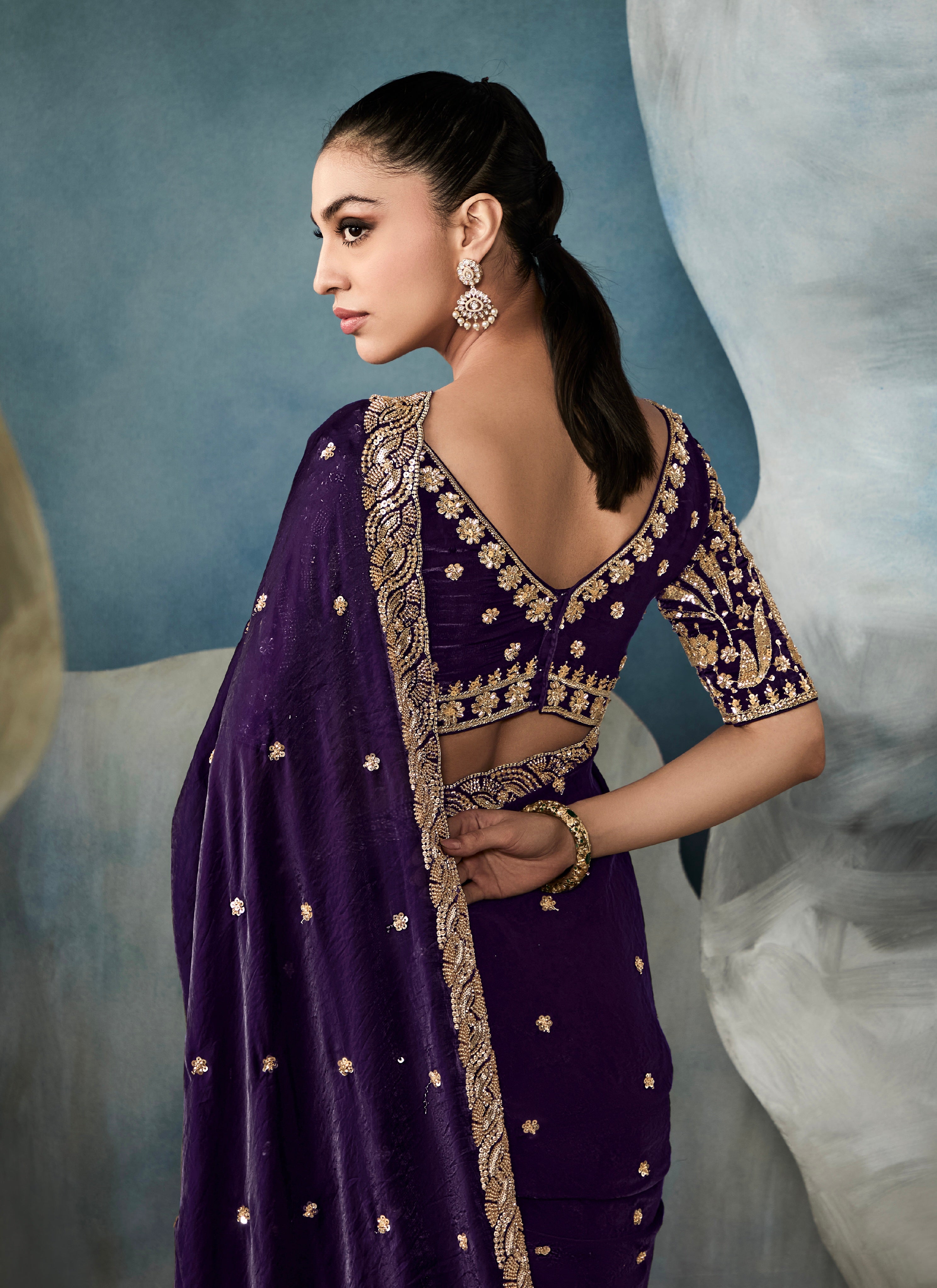 Elegant purple tissue saree with satin handwork blouse

