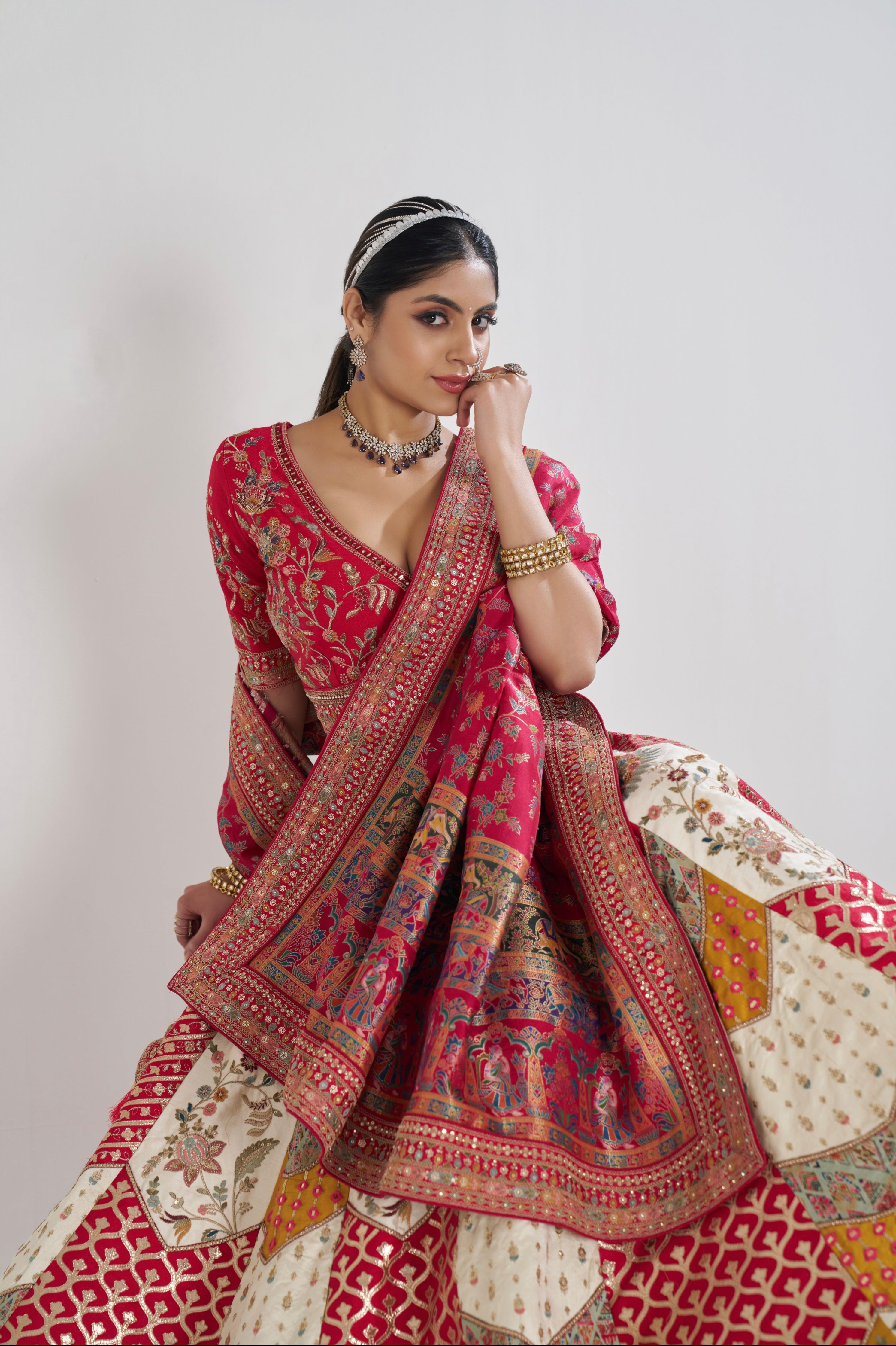 Traditional white lehenga with zari work and red dupatta