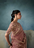 Wedding wear dusty rose tissue saree with handwork details

