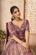 Royal purple bridal lehenga choli with intricate zari and sequin work