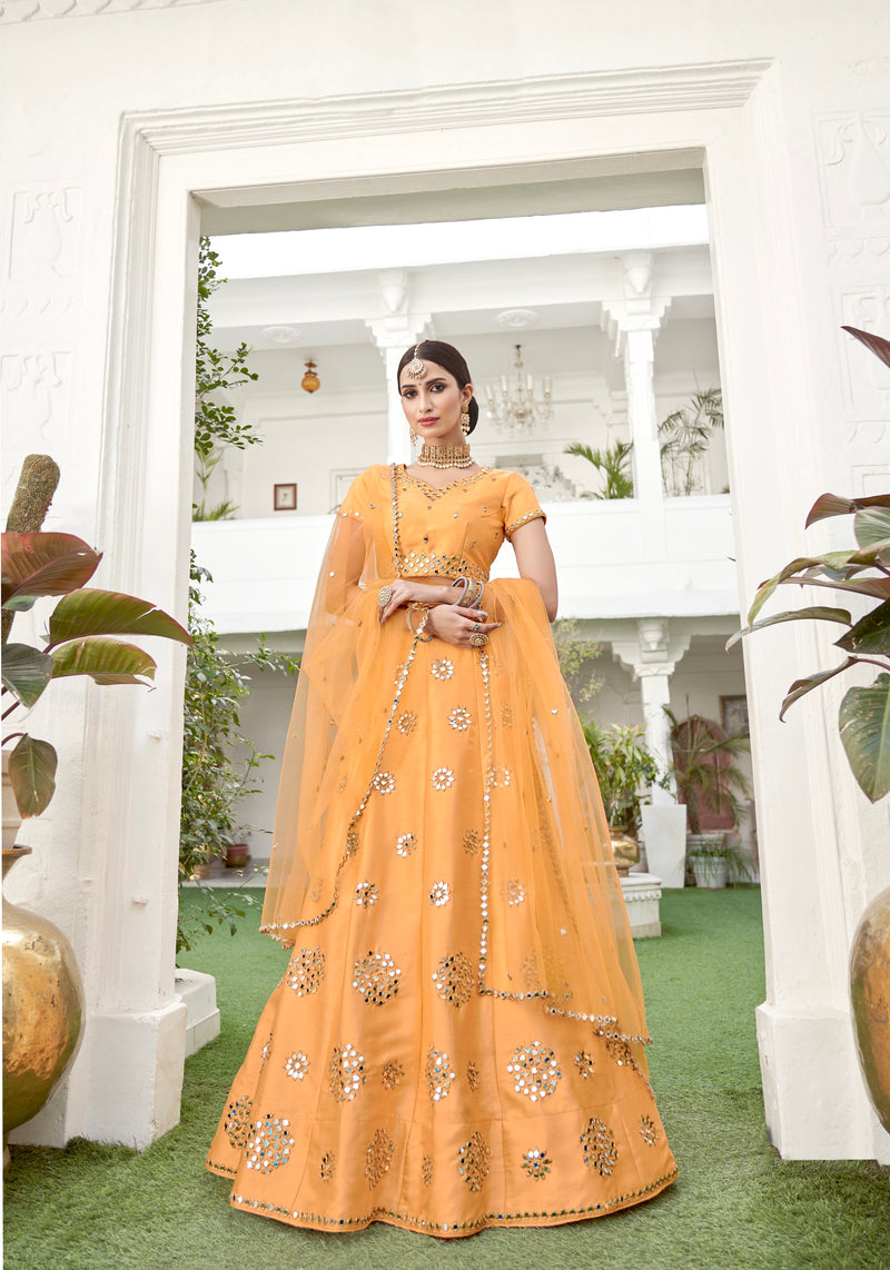 Mustard yellow bridal silk lehenga choli with mirror embroidery

