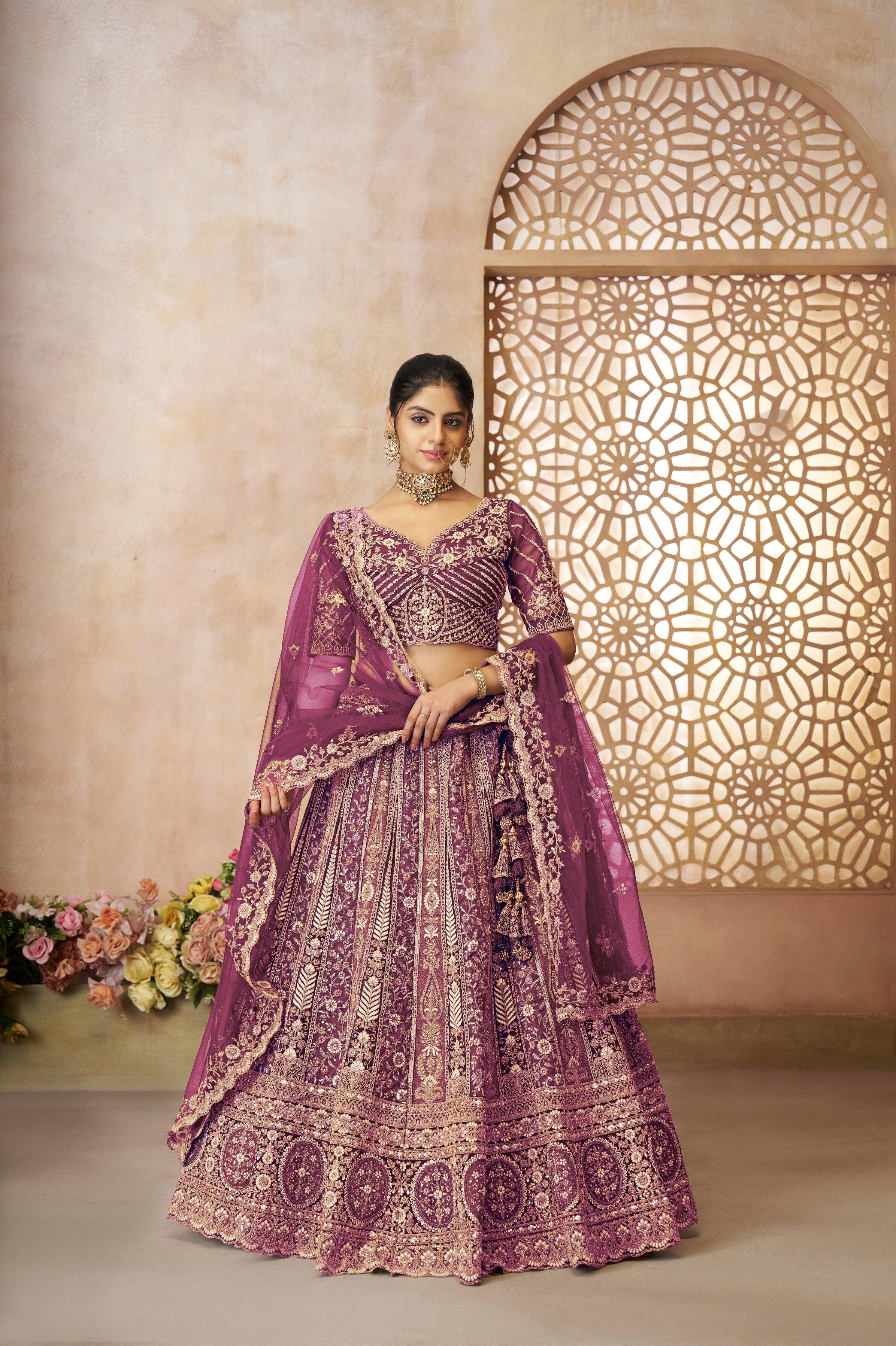 Dark purple designer bridal lehenga set with heavy embroidery and embellishments