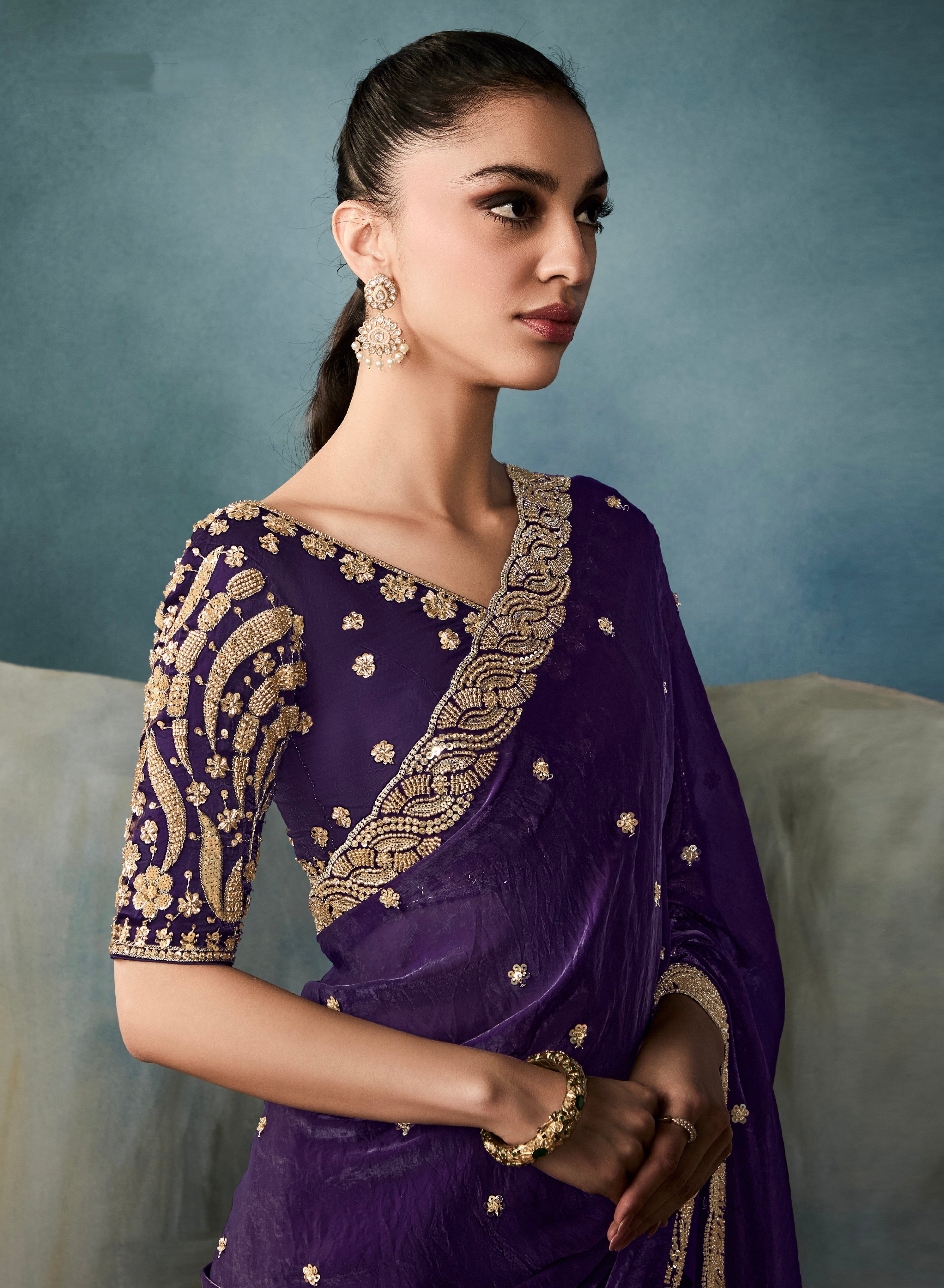 Royal purple tissue saree with intricate embroidery for festive wear

