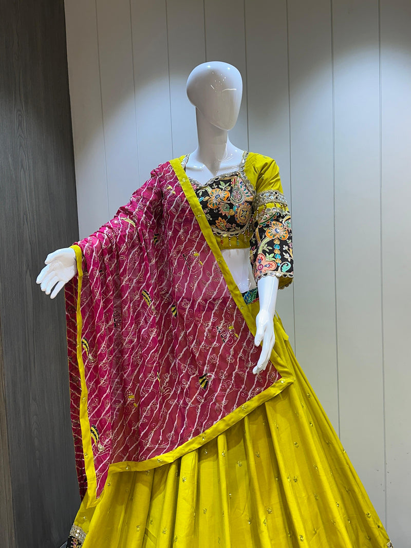 Bandhani dupatta paired with yellow lehenga choli

