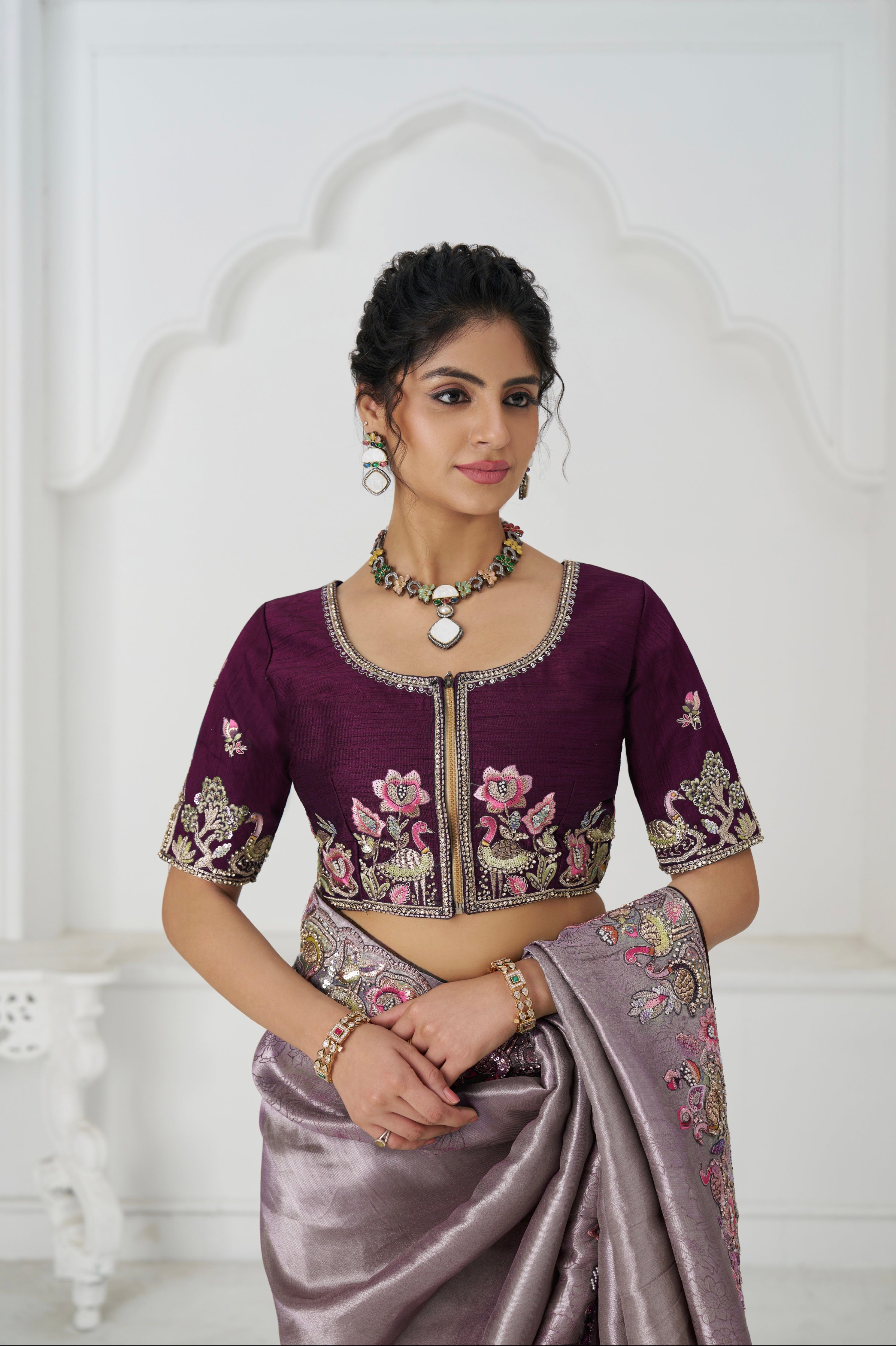 Traditional mauve saree with handcrafted embellishments