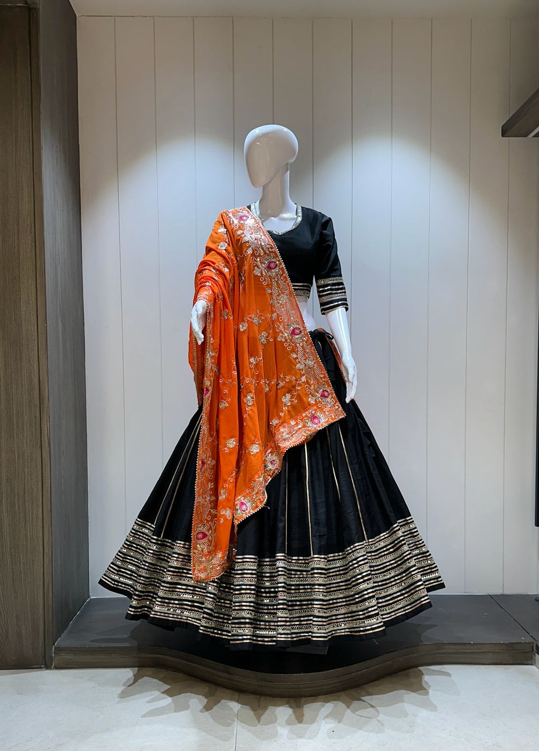 Black chaniya choli with orange dupatta

