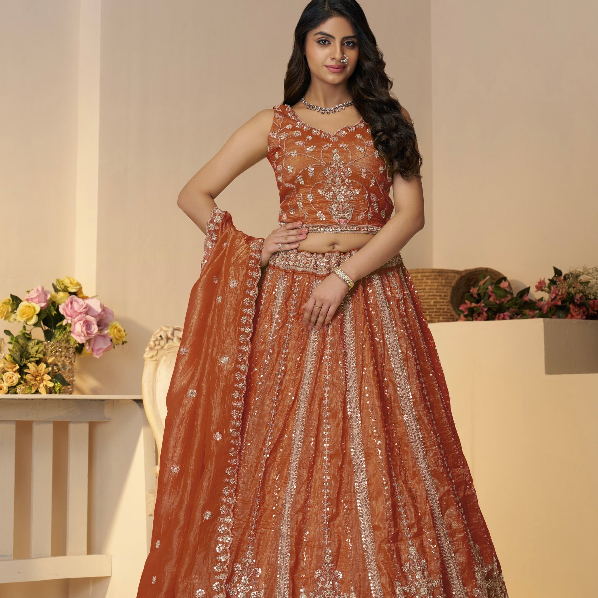 Wedding lehenga in orange with handcrafted blouse and dupatta

