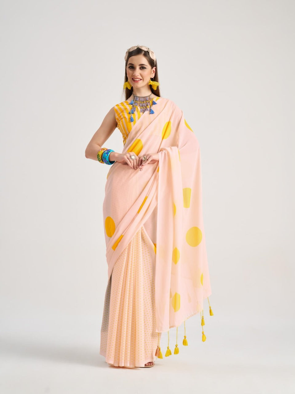 Peach georgette saree with yellow polka dots


