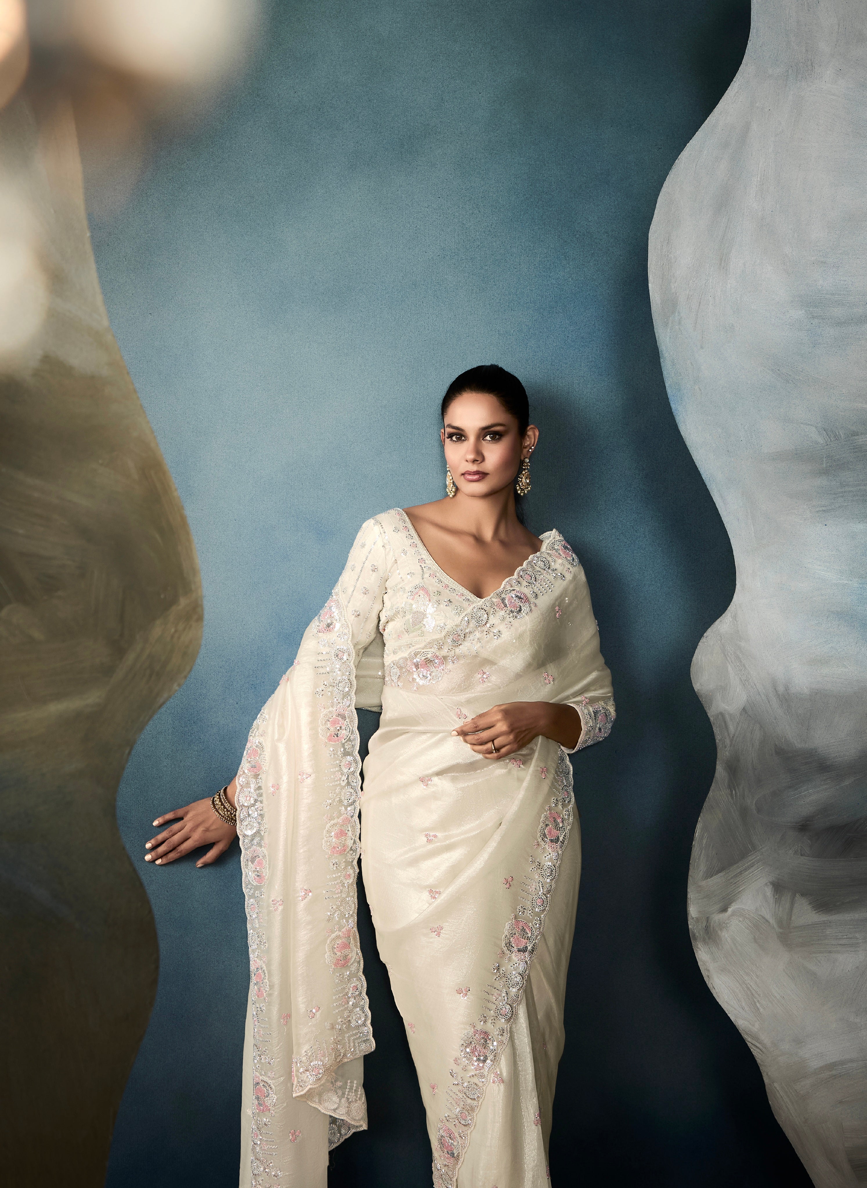 Elegant off-white tissue saree with cutwork details for wedding

