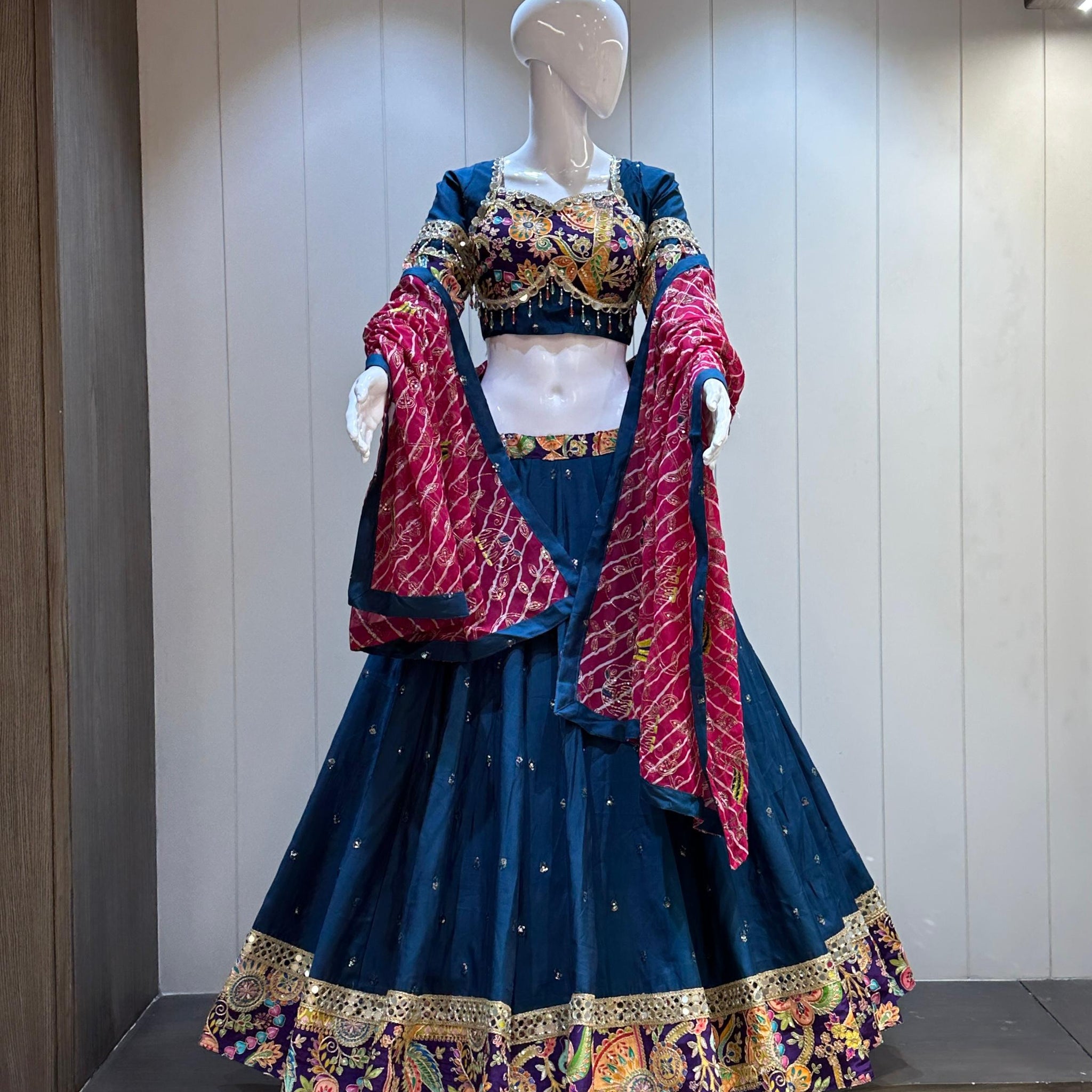 Navy blue chaniya choli with red bandhani dupatta

