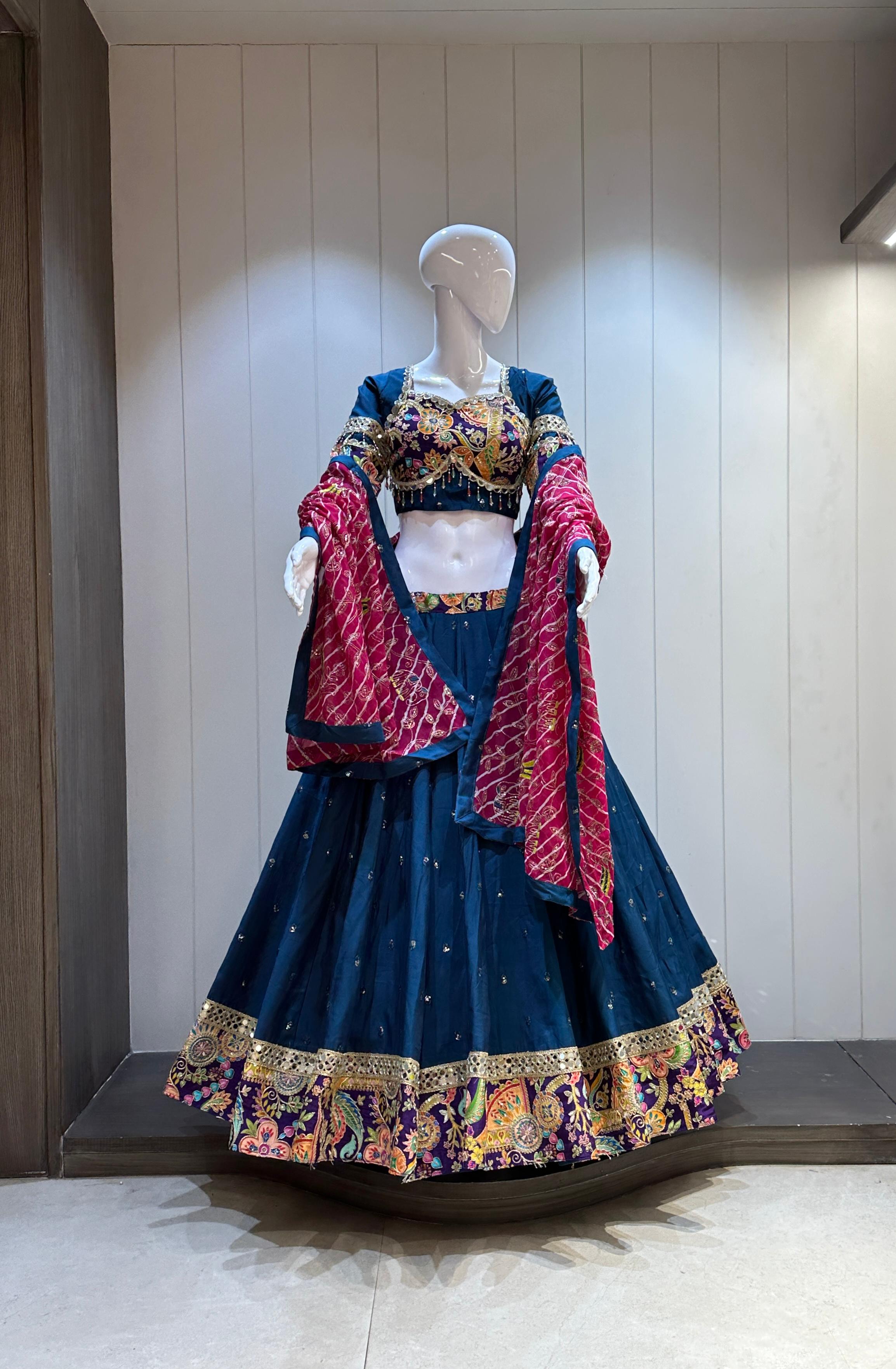 Navy blue chaniya choli with red bandhani dupatta

