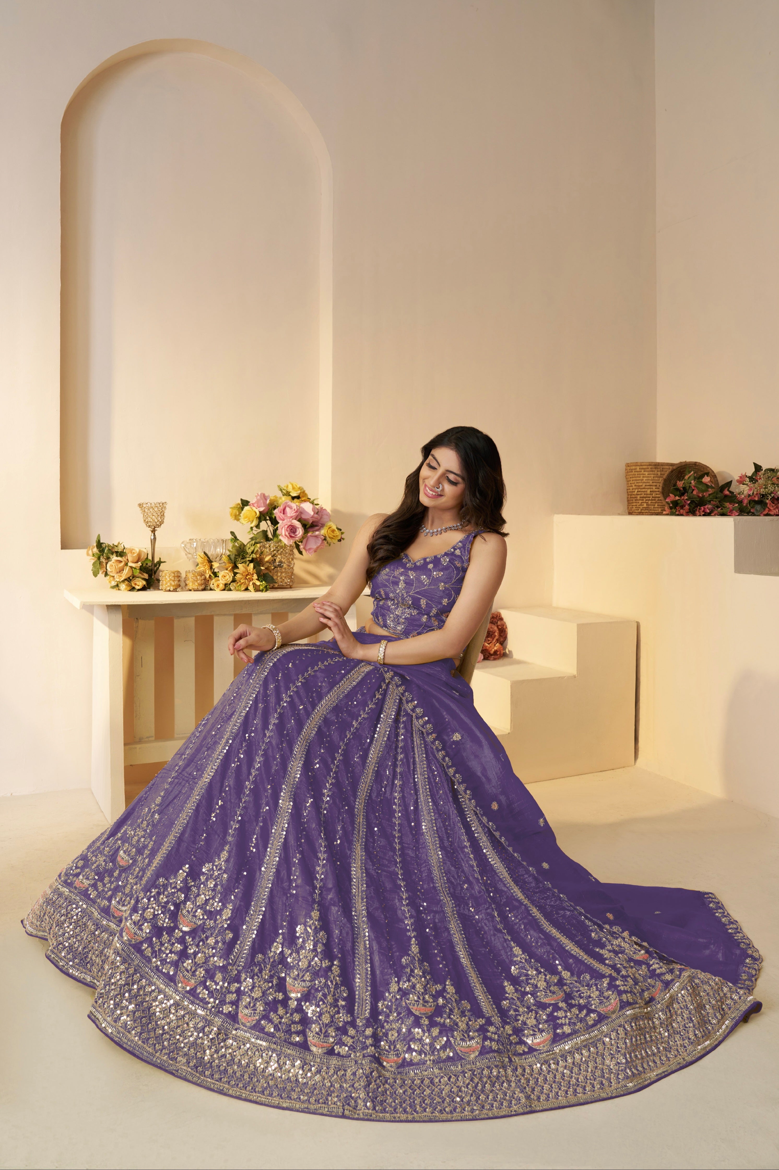 Zari embellished purple lehenga with net dupatta and blouse