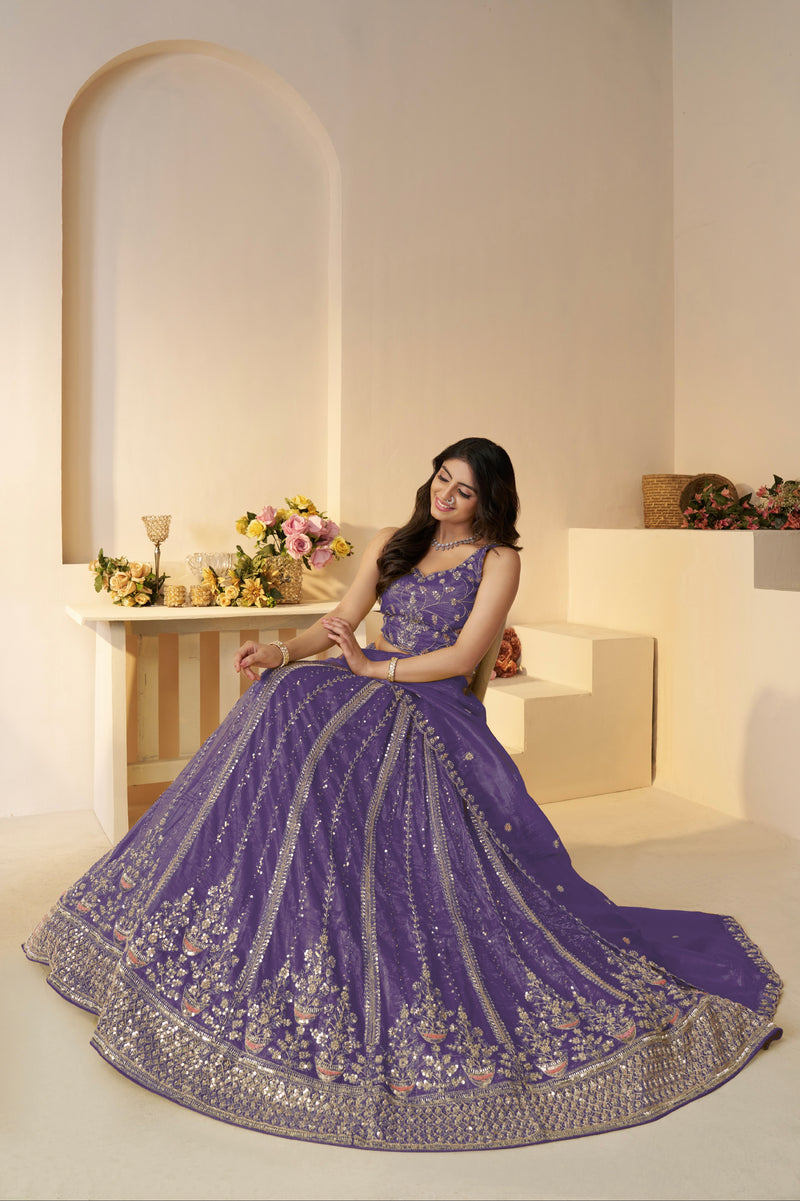 Zari embellished purple lehenga with net dupatta and blouse